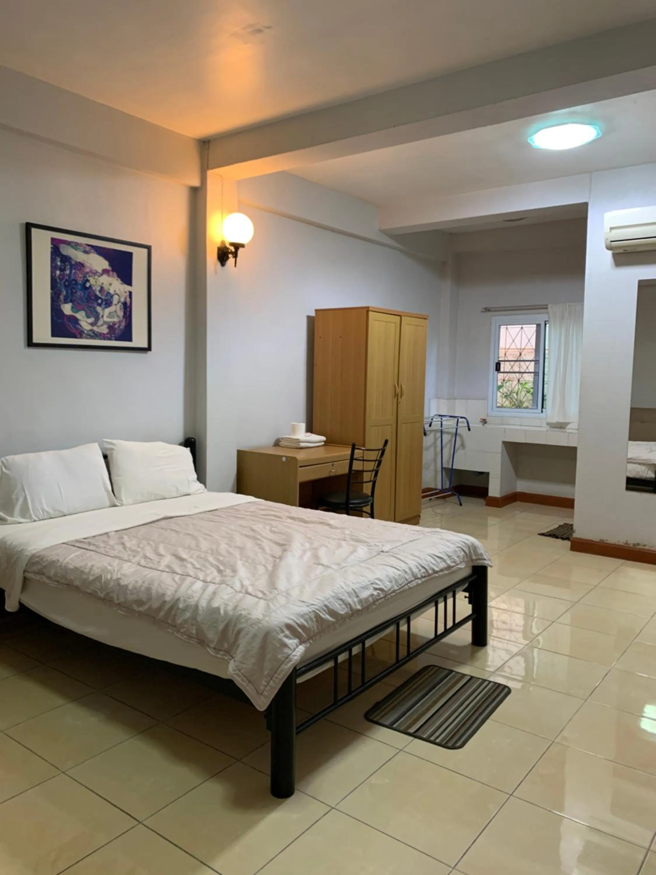 Bed in Pikul Apartment Hotel