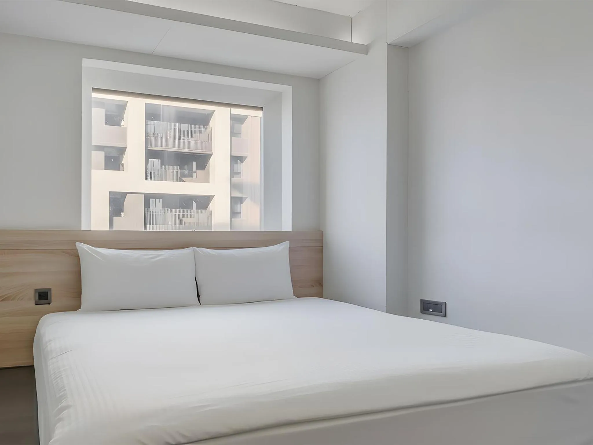 Bed in CHECK inn Taichung Liming