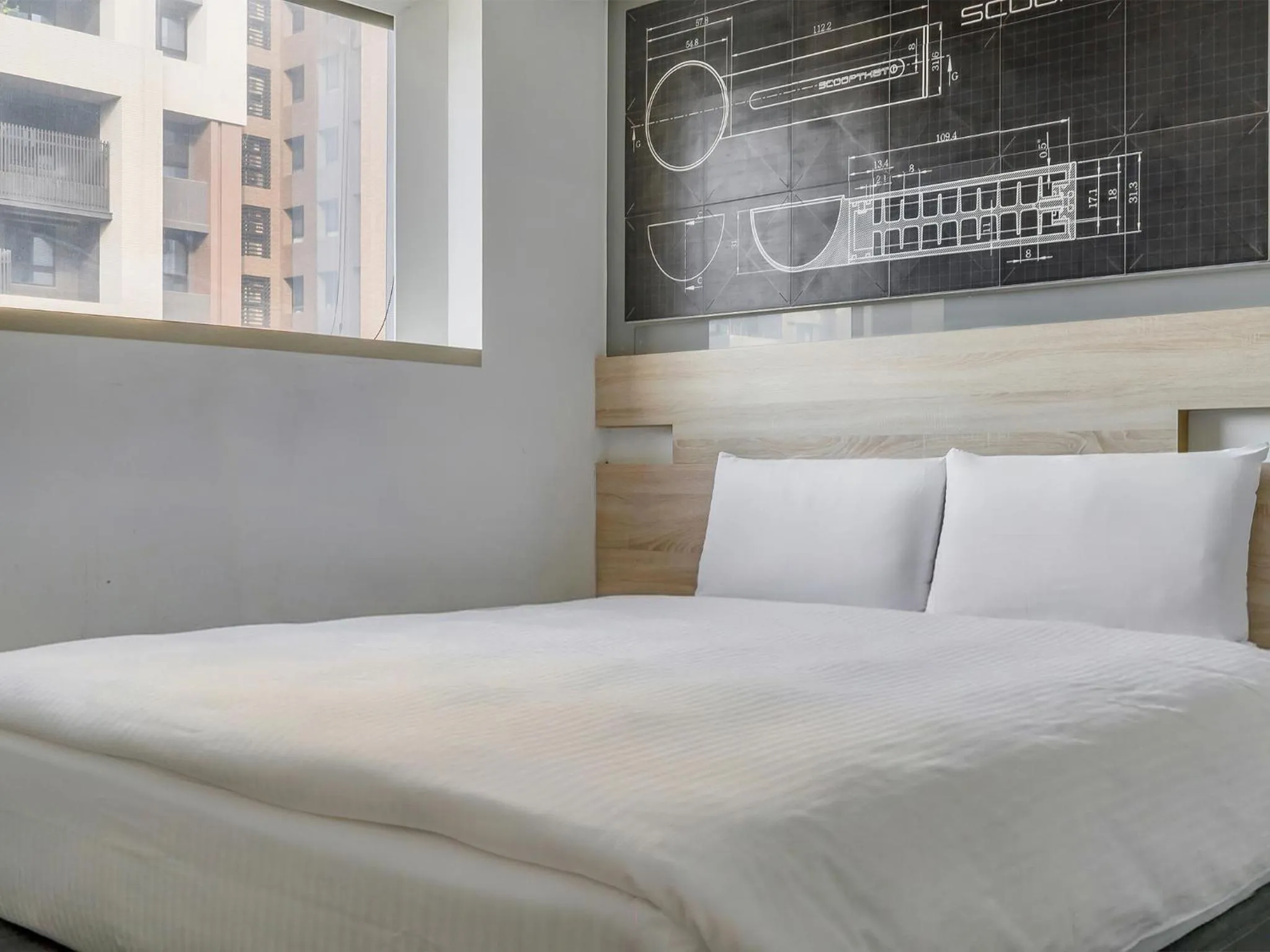 Bed in CHECK inn Taichung Liming