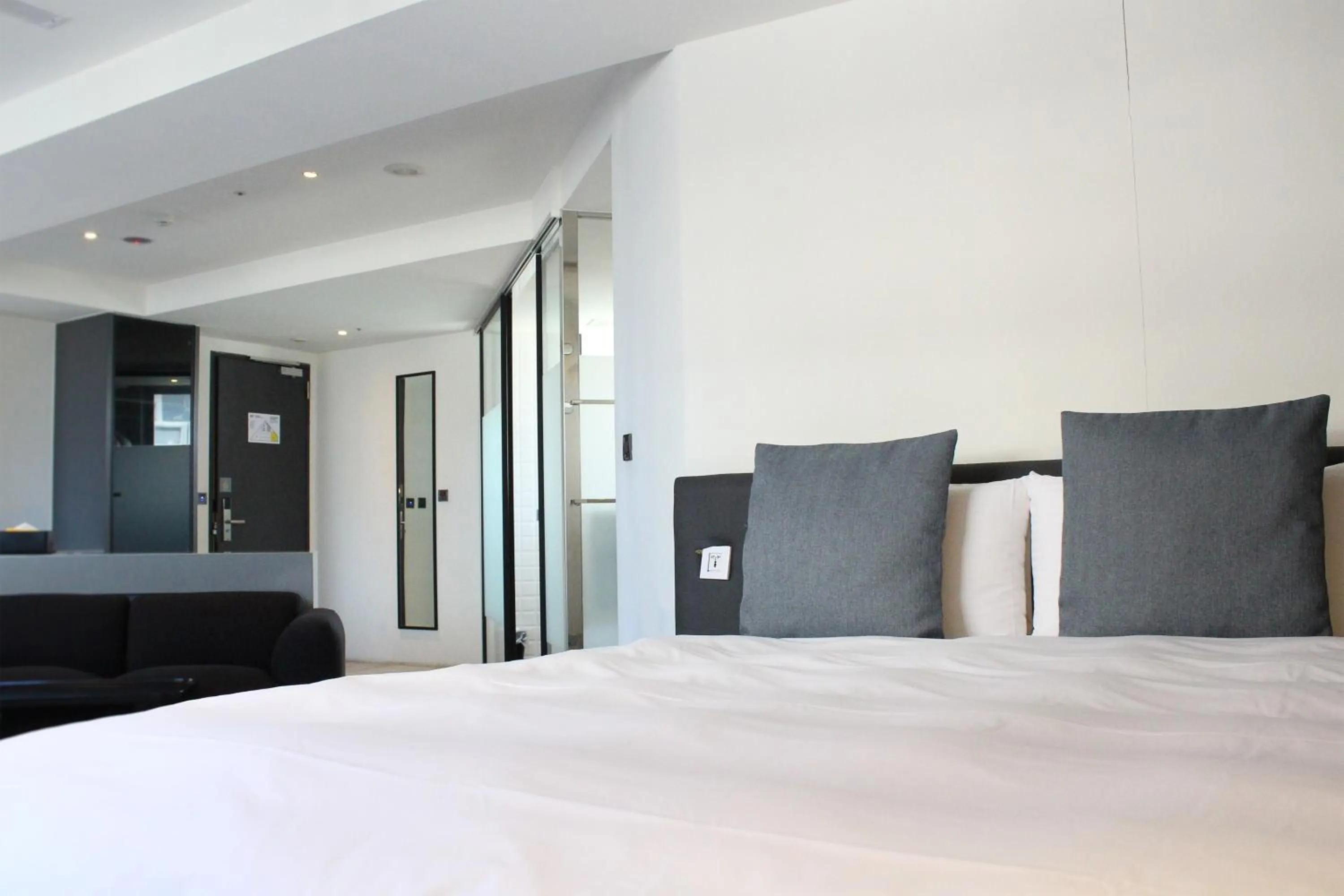 Bed in CHECK inn Taichung Liming