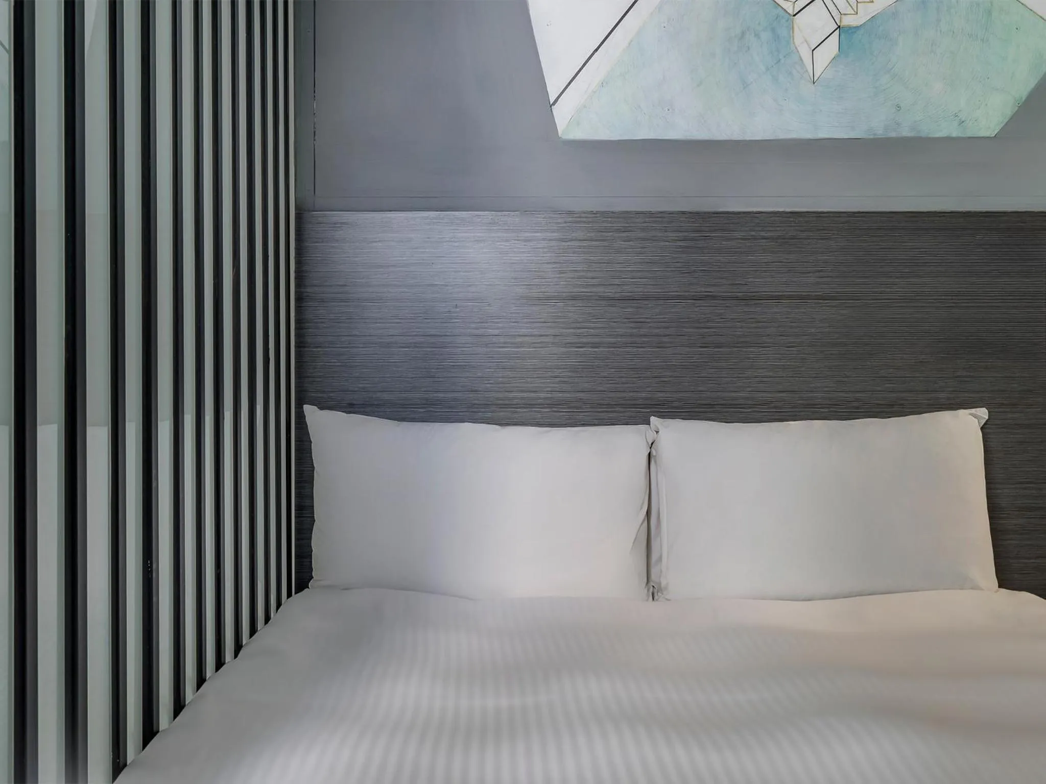 Bed in CHECK inn Taichung Liming