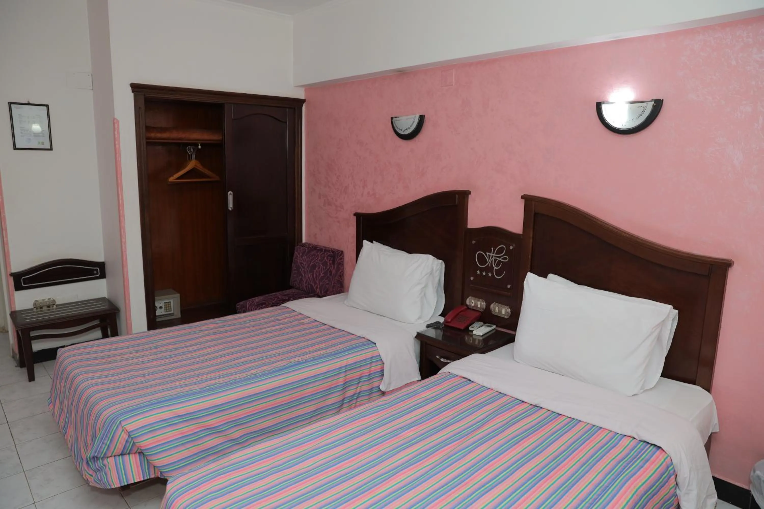 Bed in Happy City Hotel