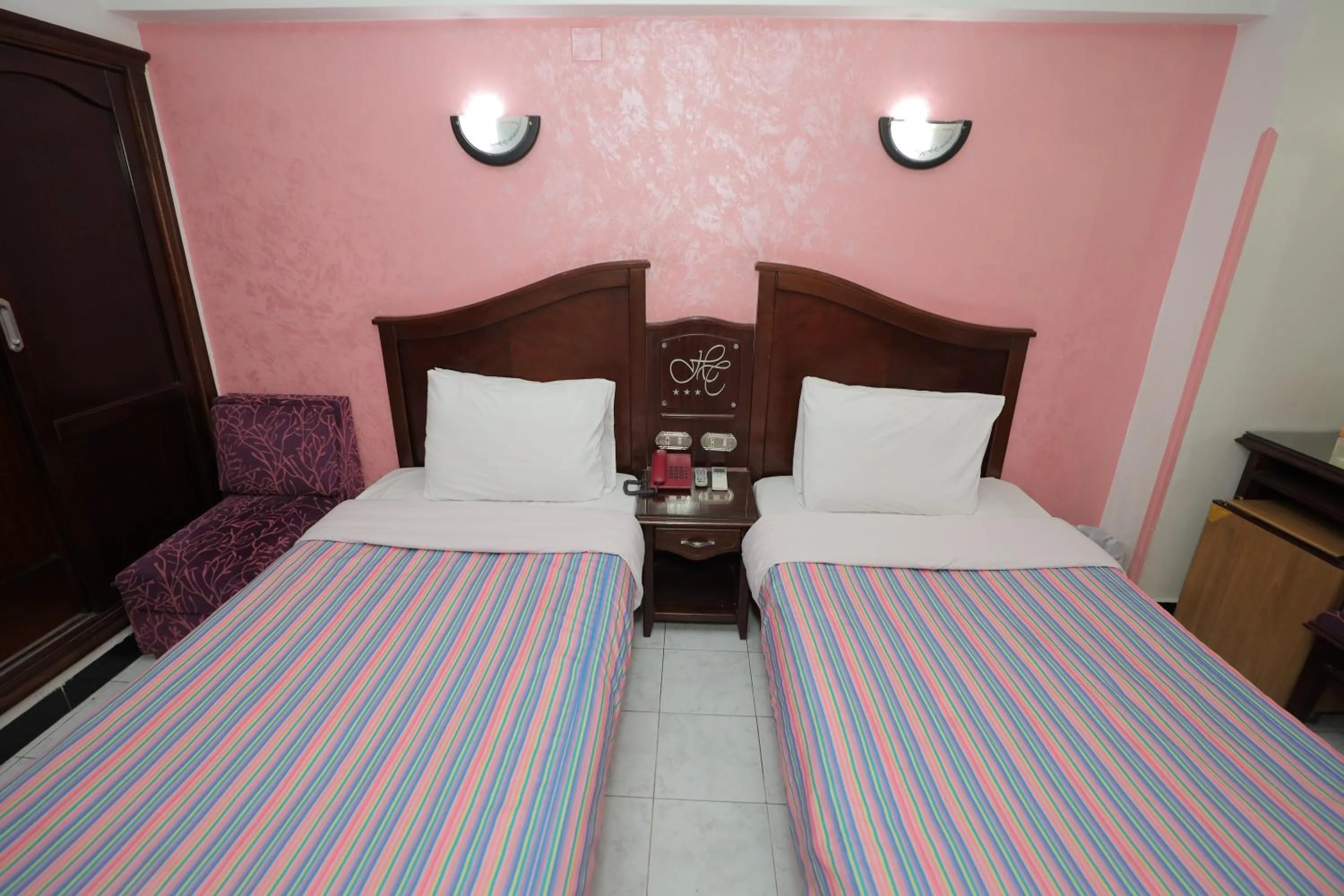 Bed in Happy City Hotel