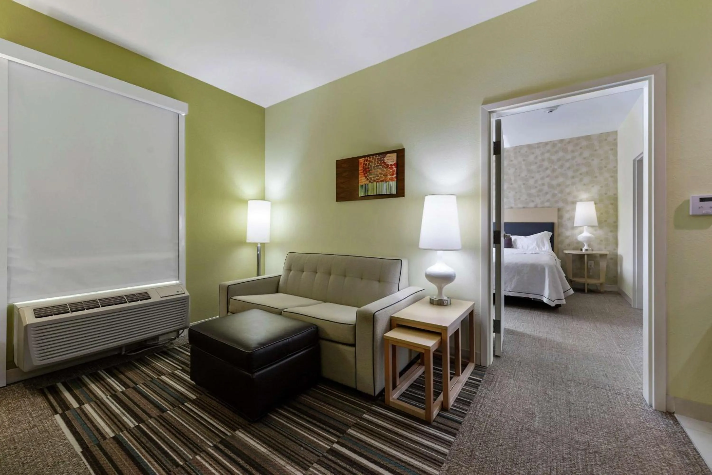 Living room, Bed in Home2 Suites by Hilton Gulfport I-10