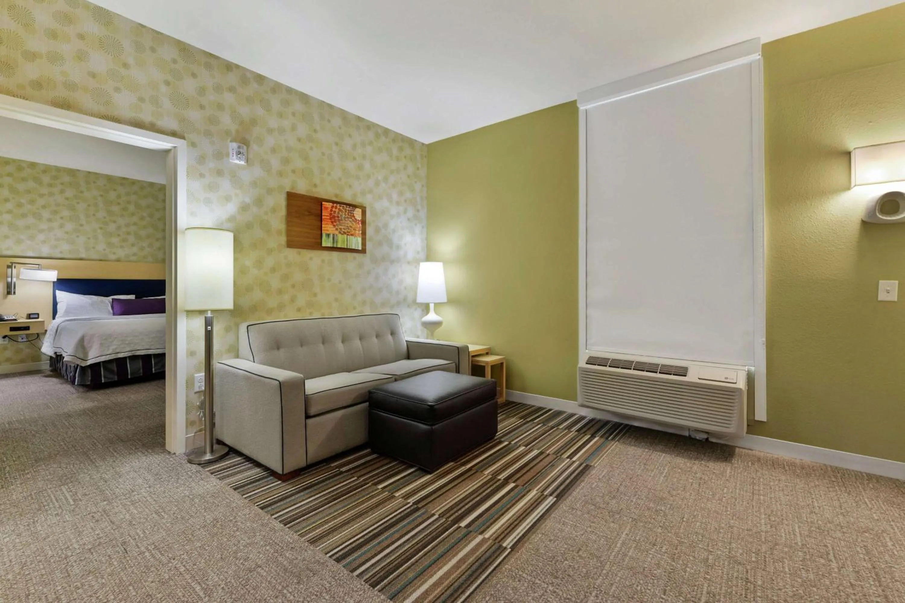 Living room, Bed in Home2 Suites by Hilton Gulfport I-10