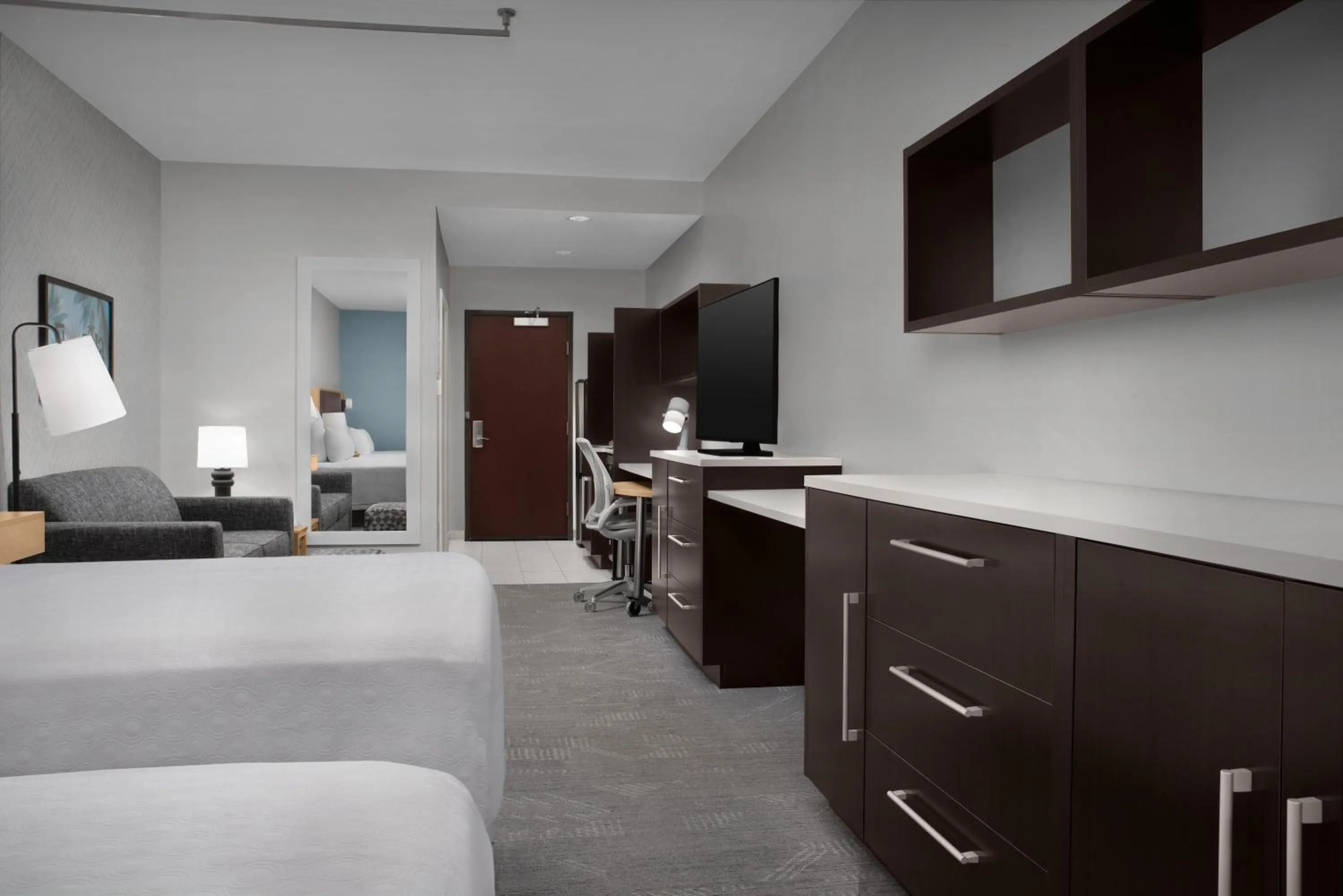 Living room, Bed in Home2 Suites by Hilton Lake City