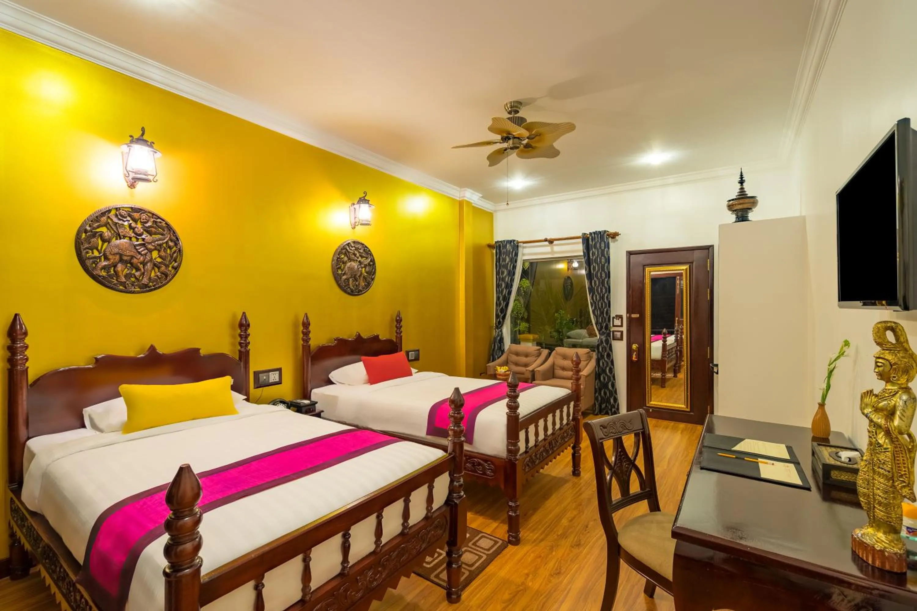 Seating area, Bed in Beyond Yangon Inn