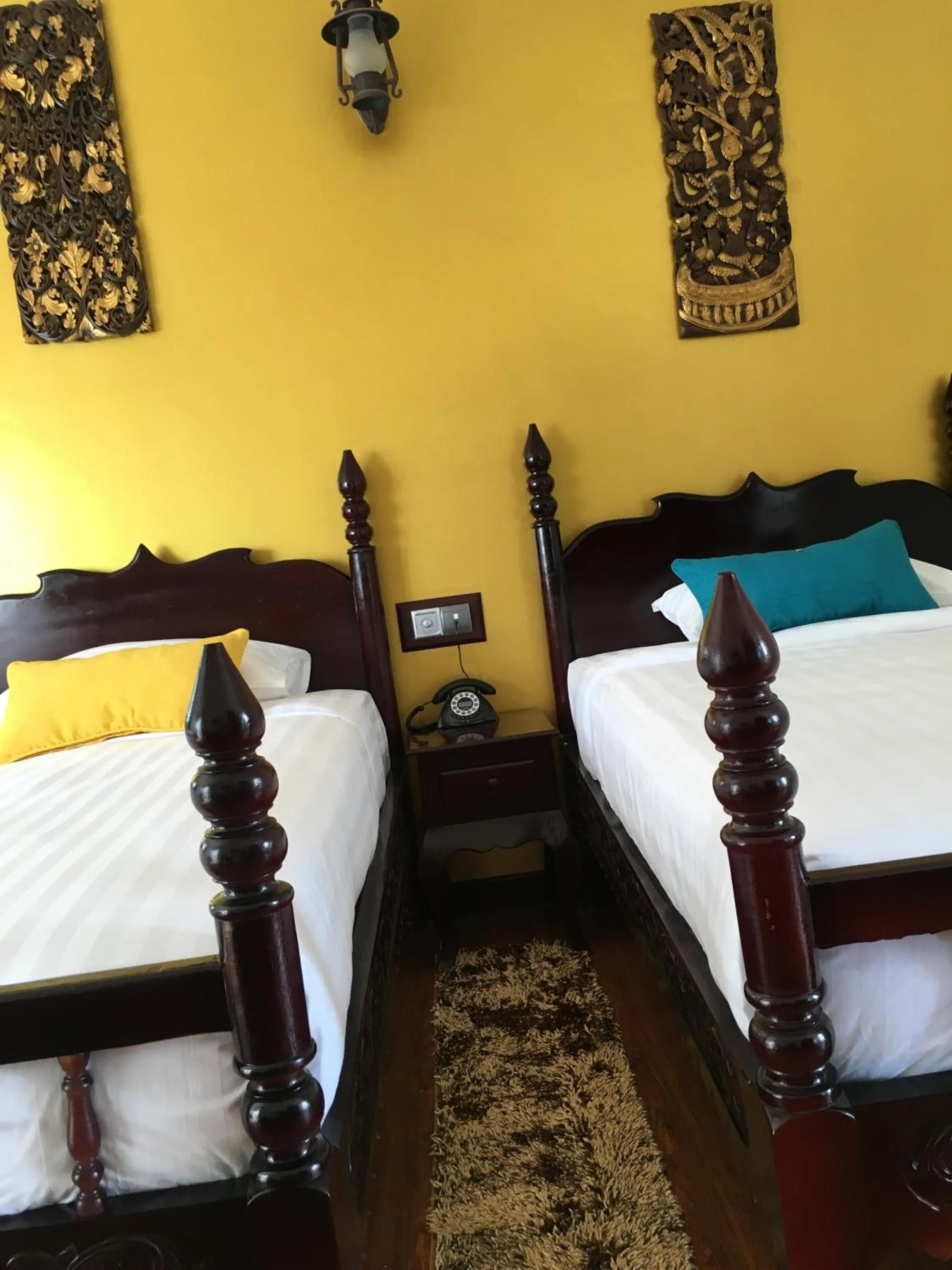 Bed in Beyond Yangon Inn