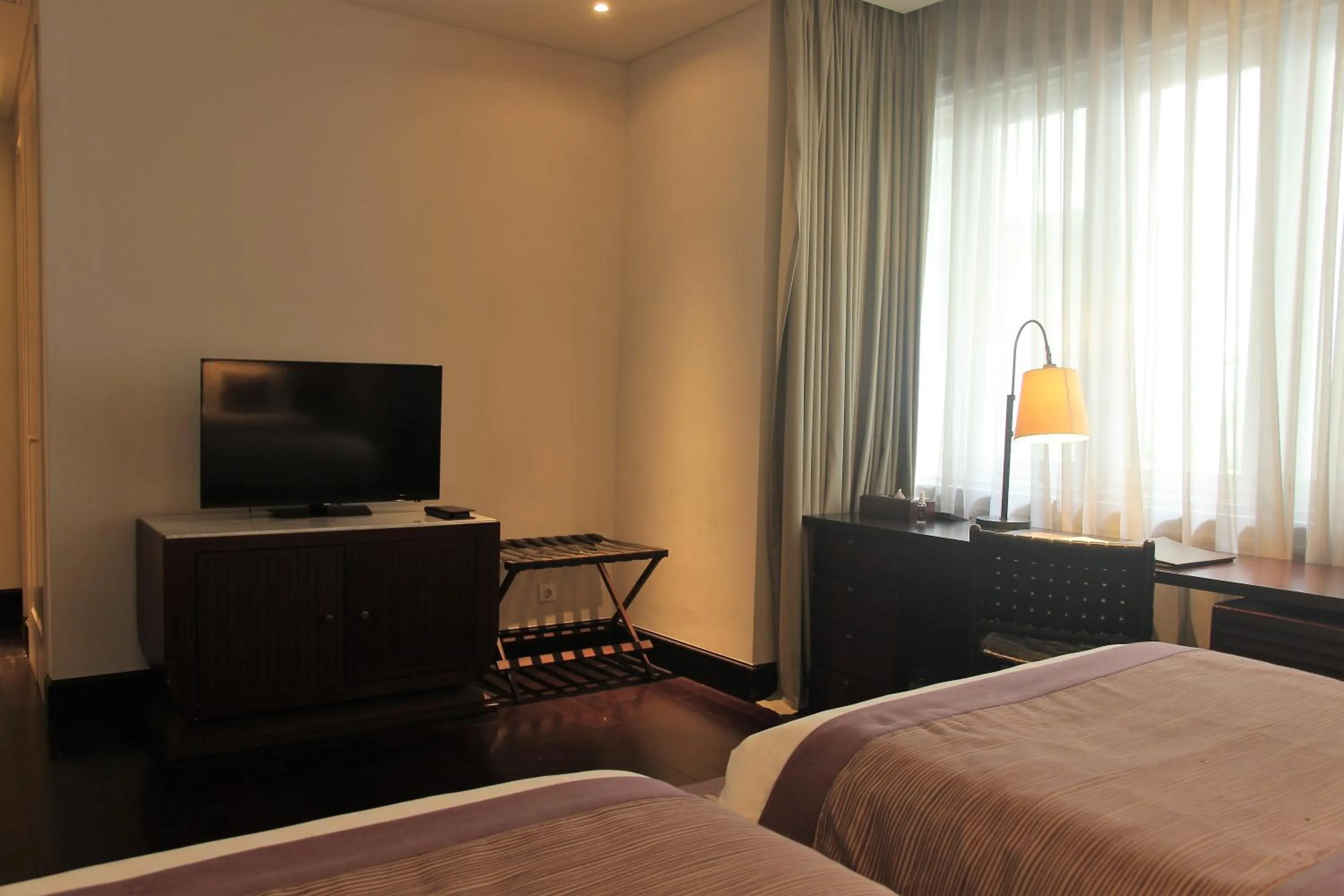 Bed in The Shalimar Boutique Hotel