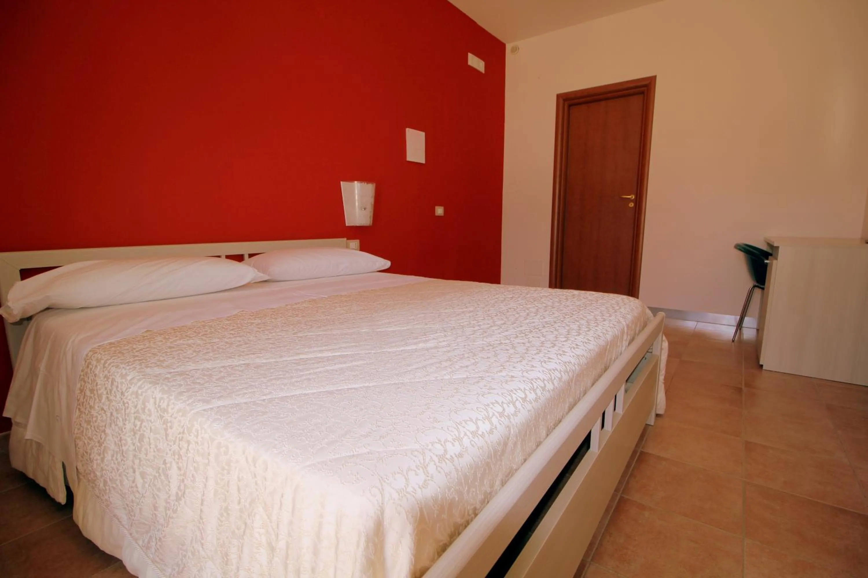 Bed in Modica Garden Resort