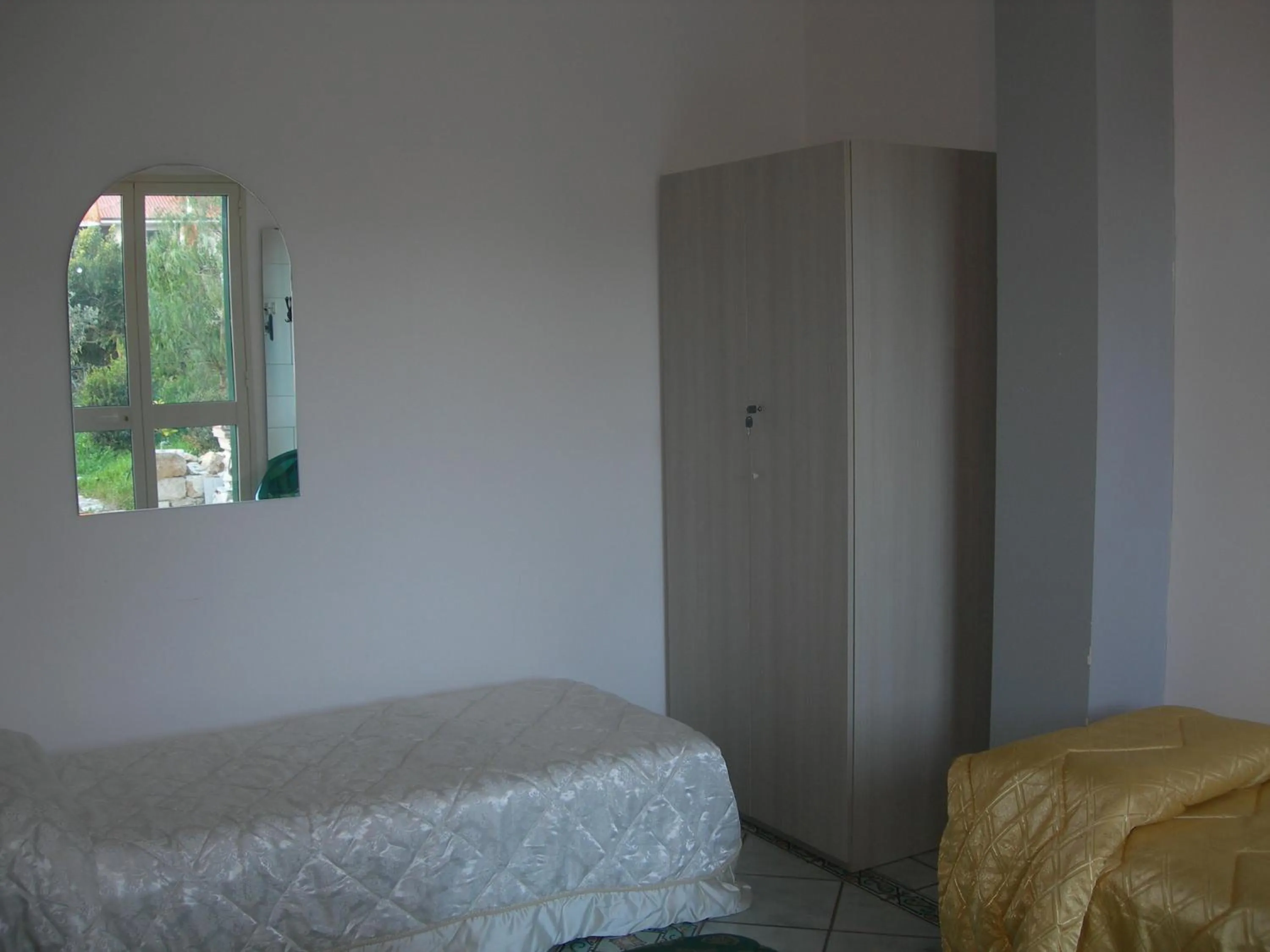 Bed in Modica Garden Resort