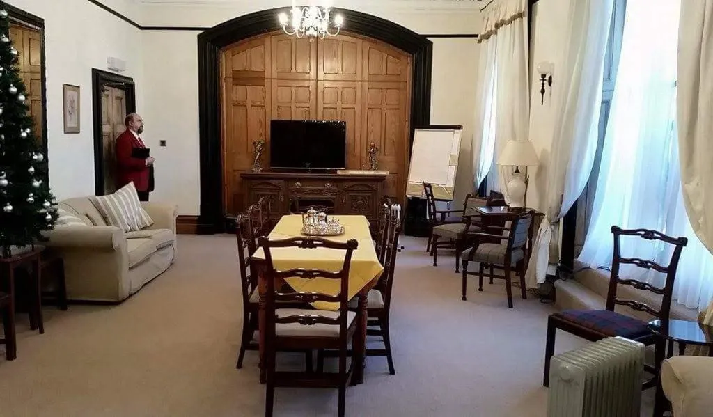 Communal lounge/ TV room in The Royal Hotel Tain