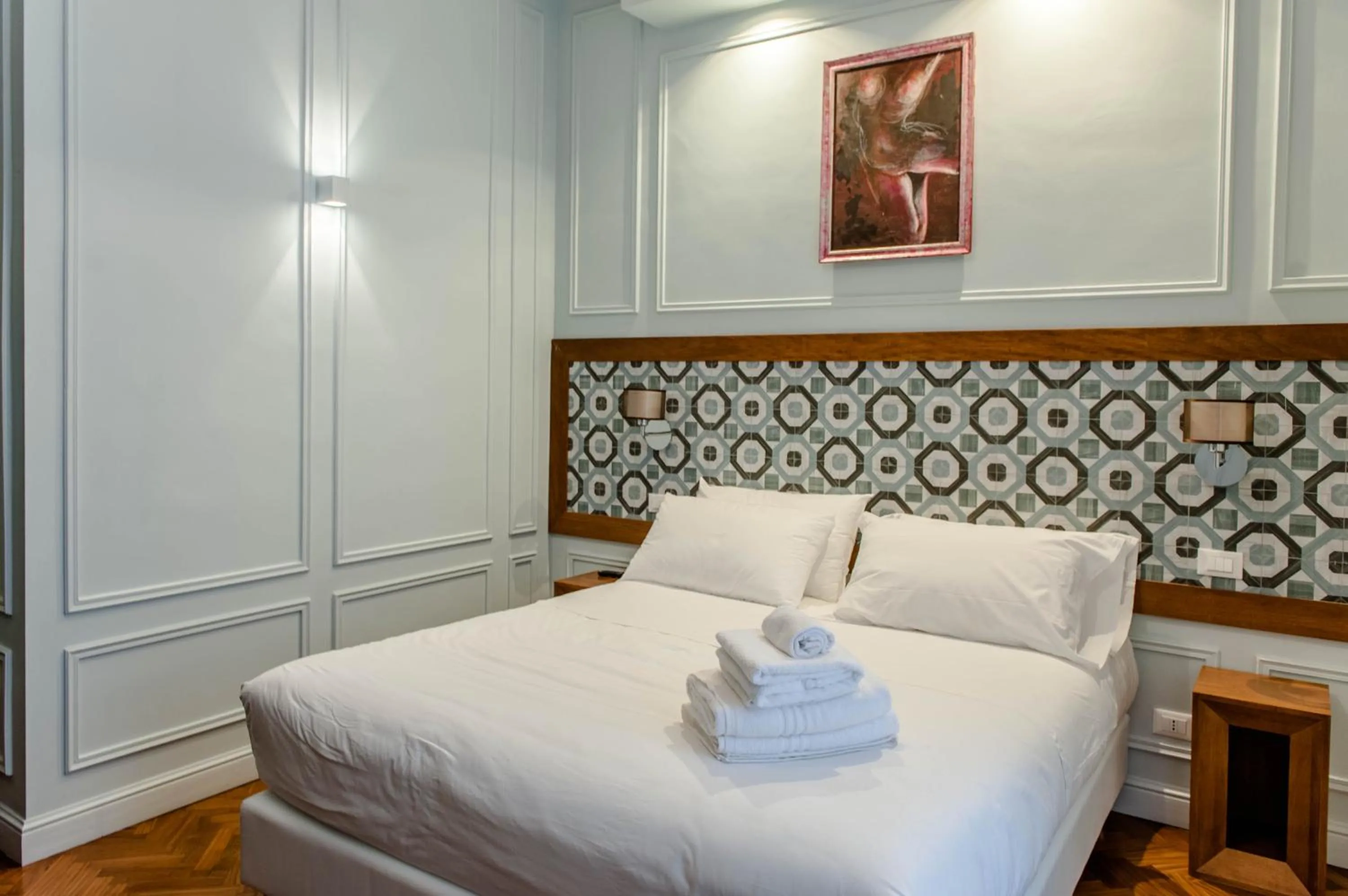 Bed in Navona Central Suites