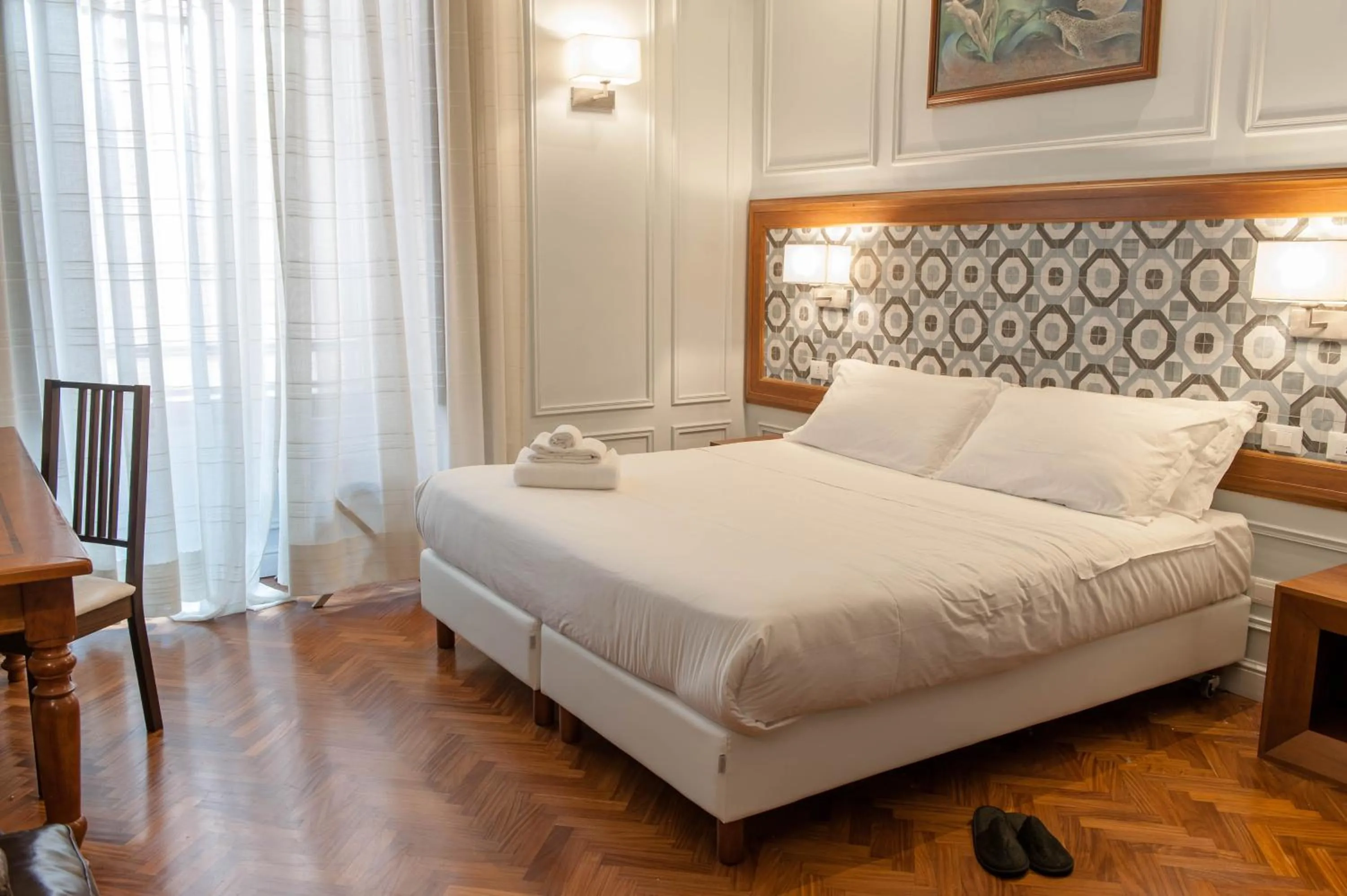 Bed in Navona Central Suites