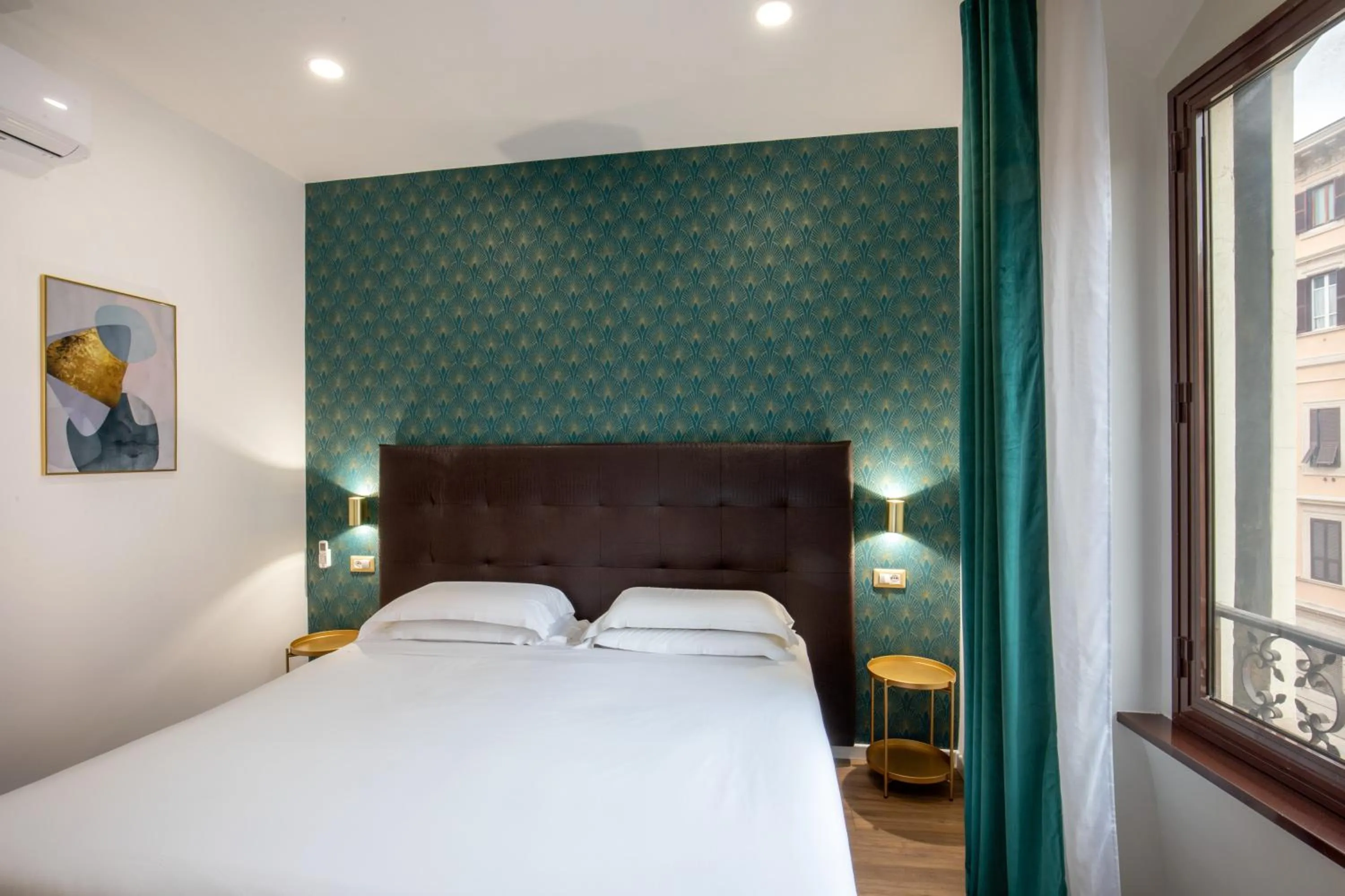 Bed in Amalia Suites by Remember Rome