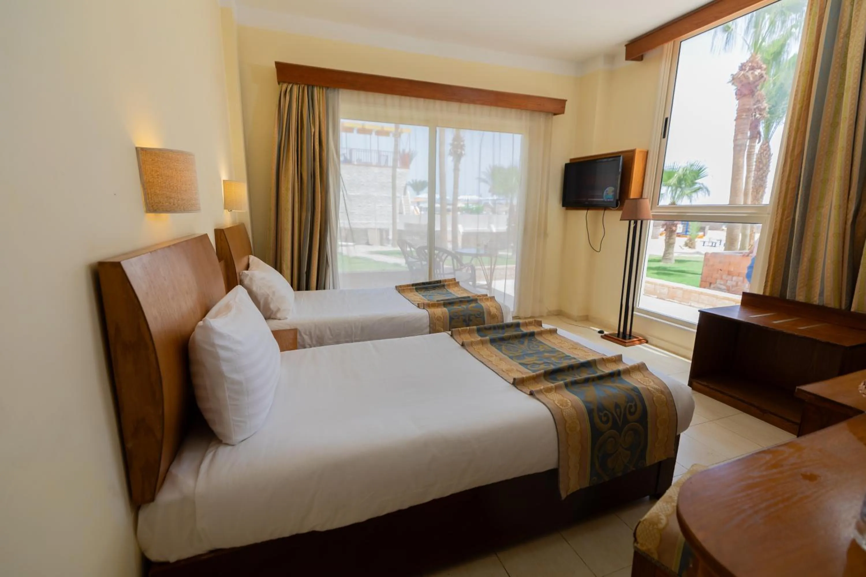 Bedroom, Bed in Empire Beach Aqua Park