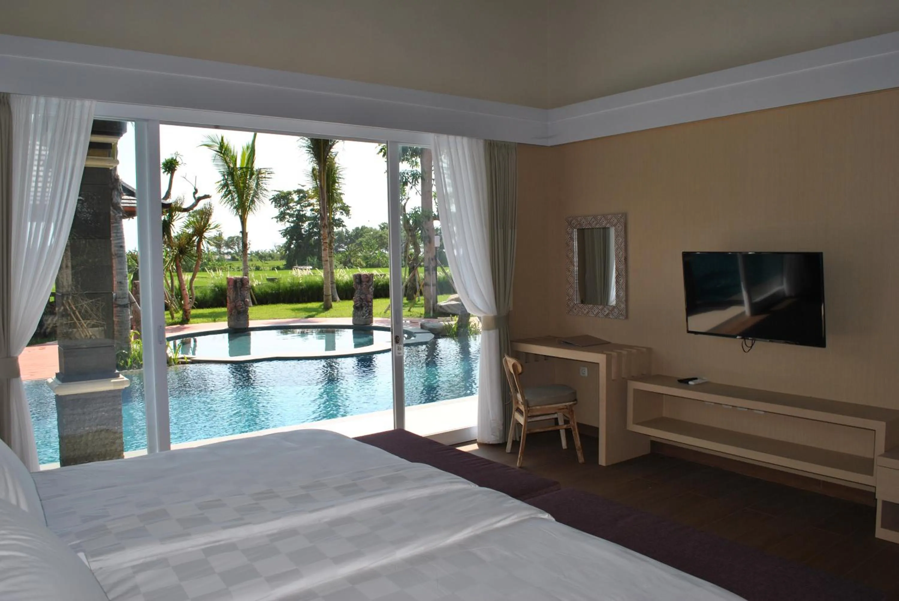 Pool view, Bed in Kori Maharani Villas & Resort