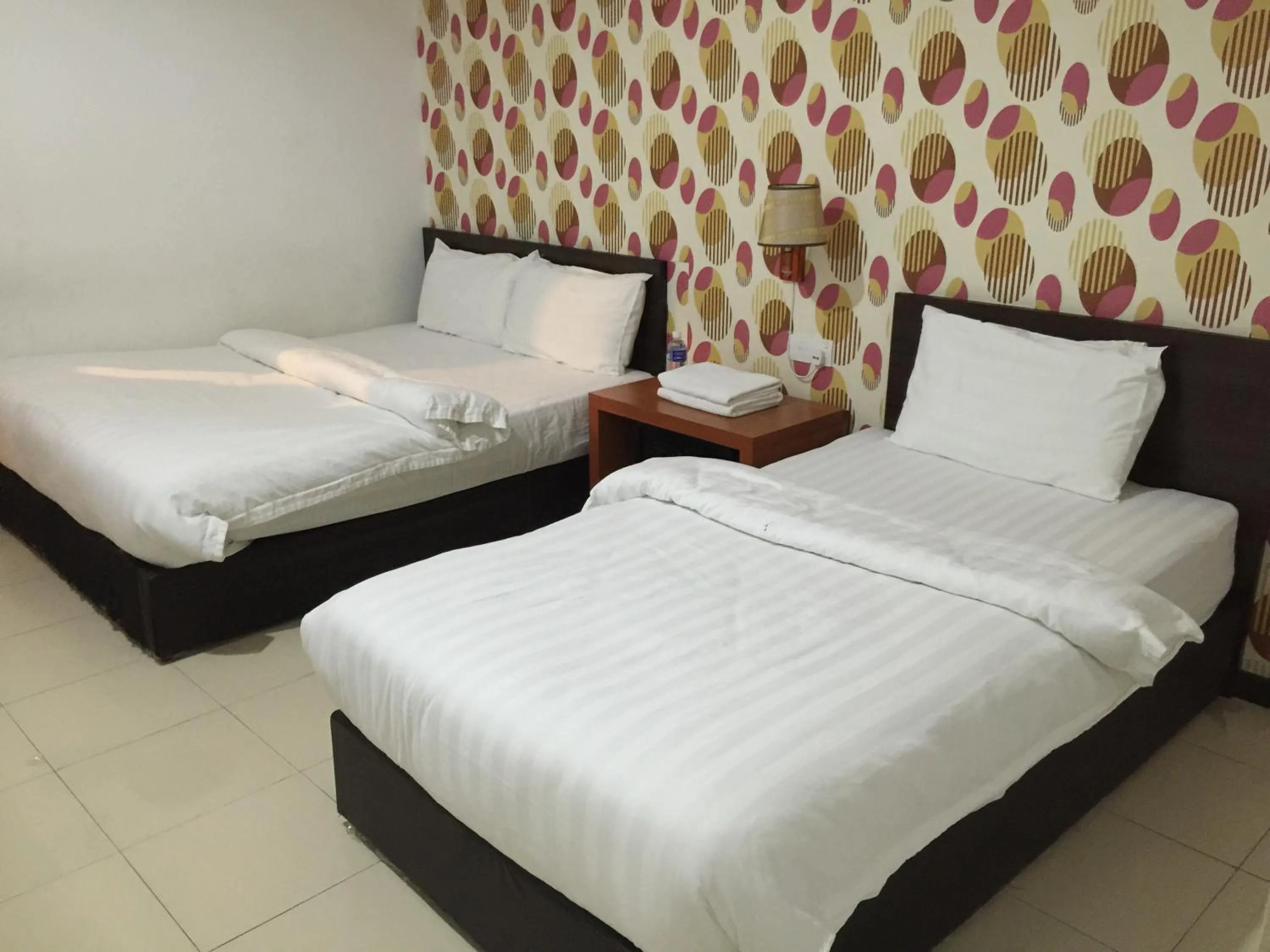 Bed in Permai Hotel