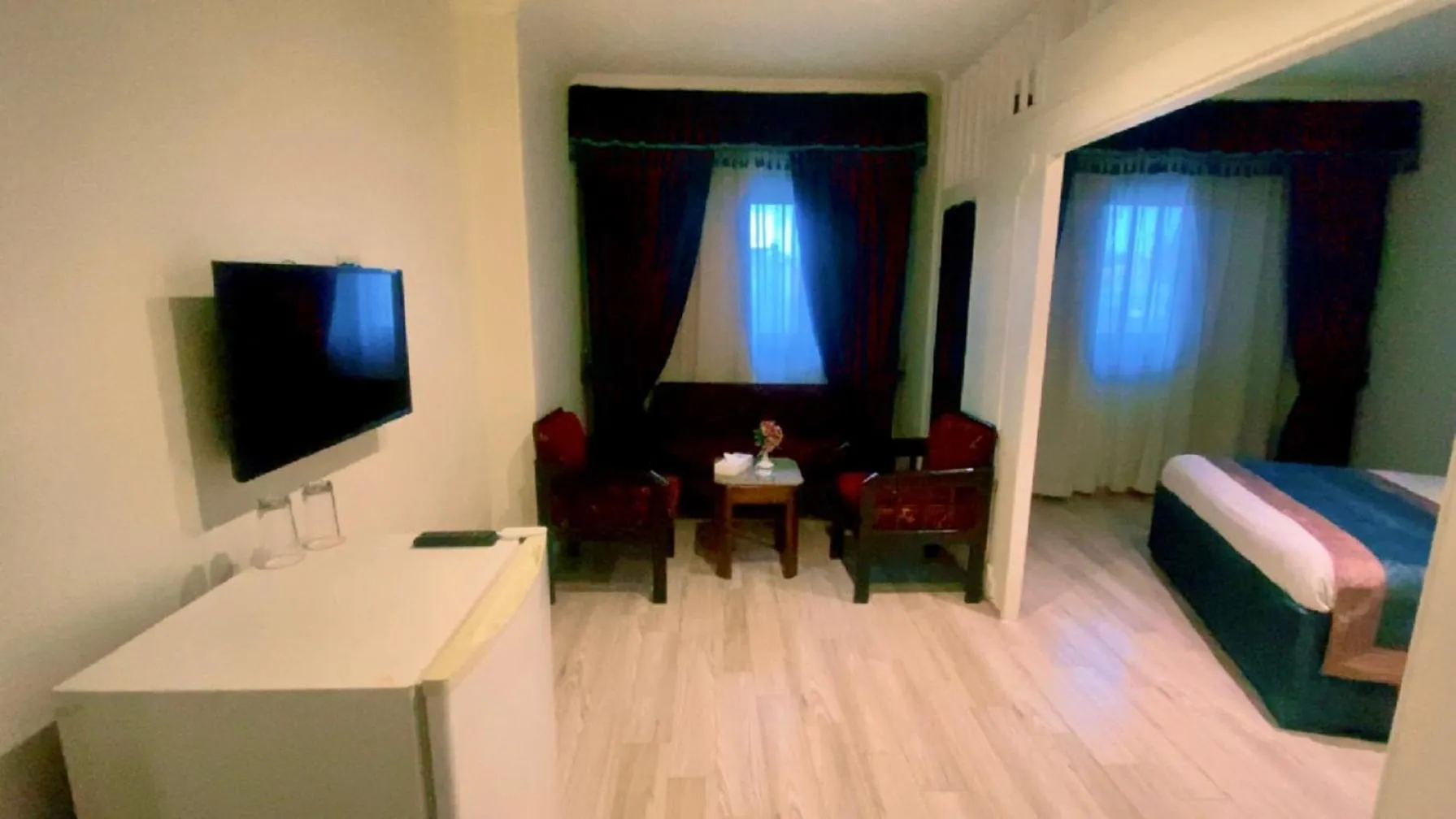 Communal lounge/ TV room, Bed in Hor Moheb Hotel