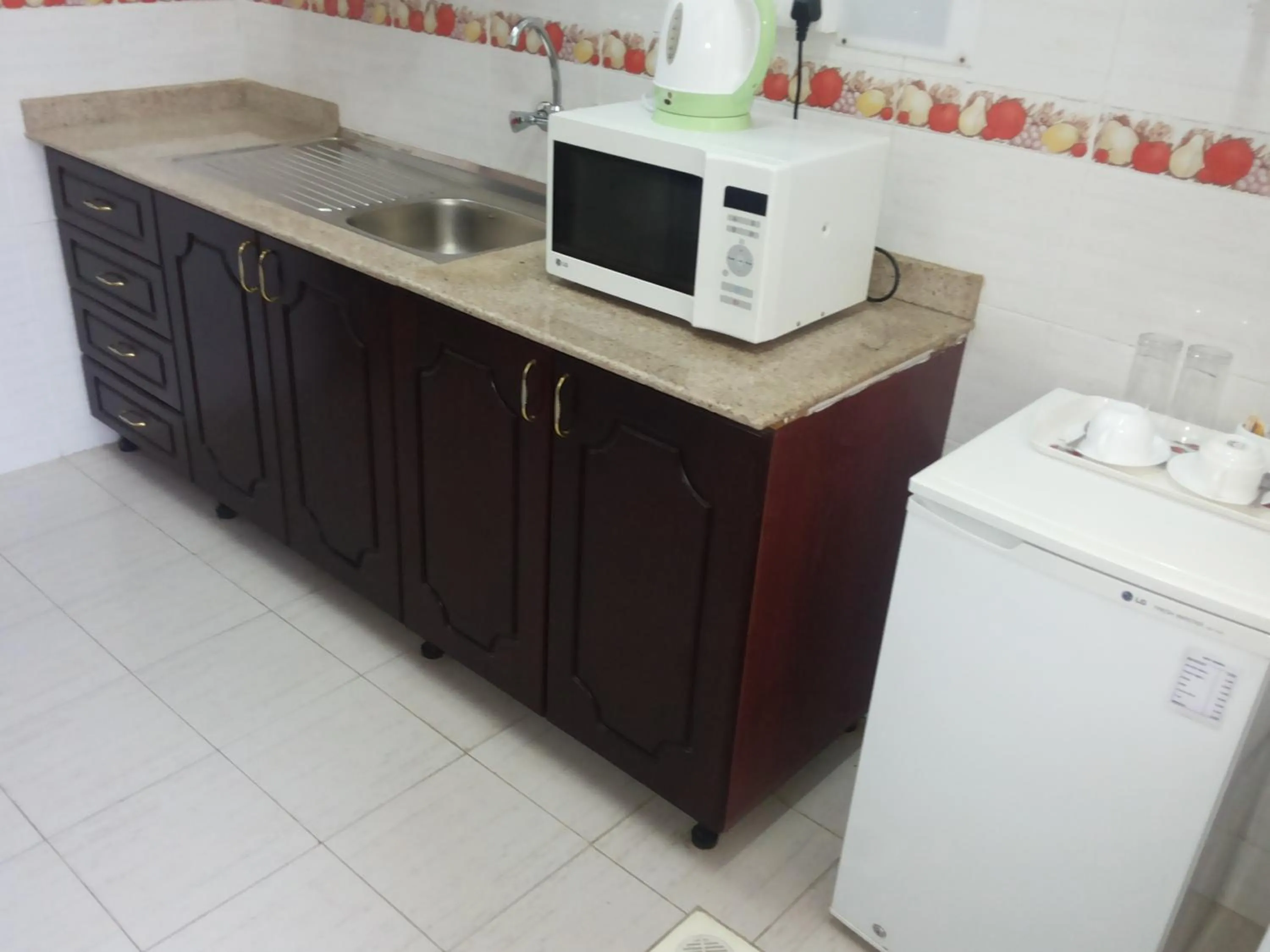 Kitchen or kitchenette in Azaiba Hotel Apartments