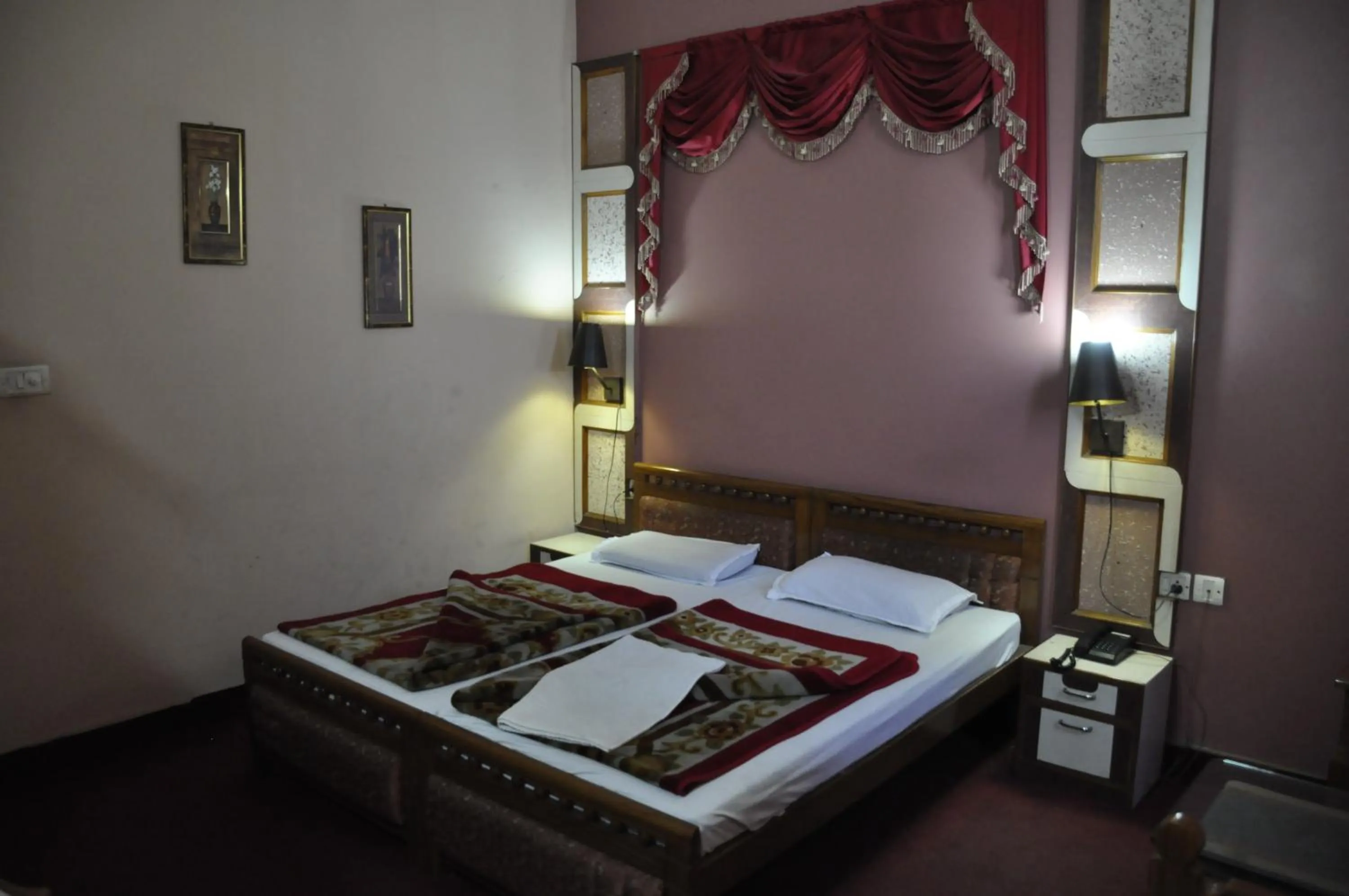 Bed in Hotel Pratiksha