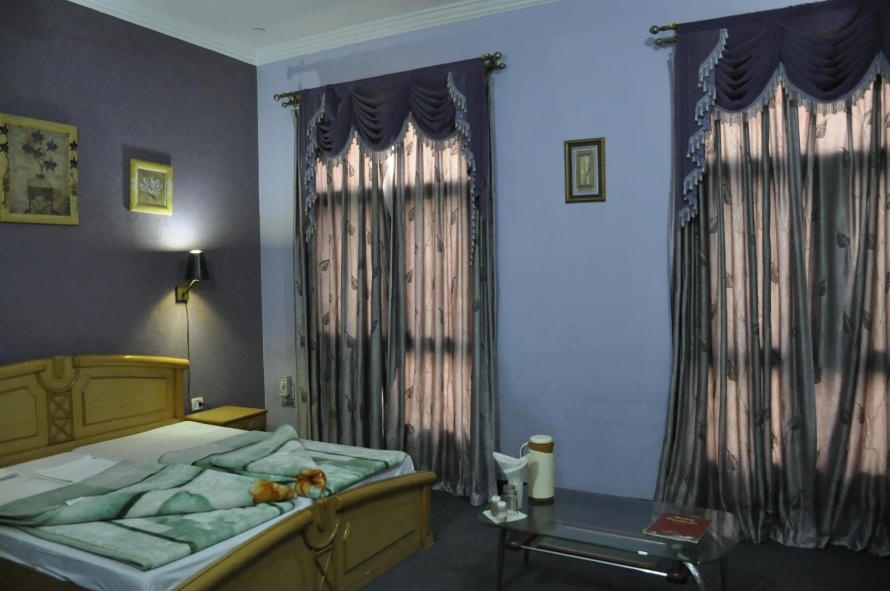 Bed in Hotel Pratiksha