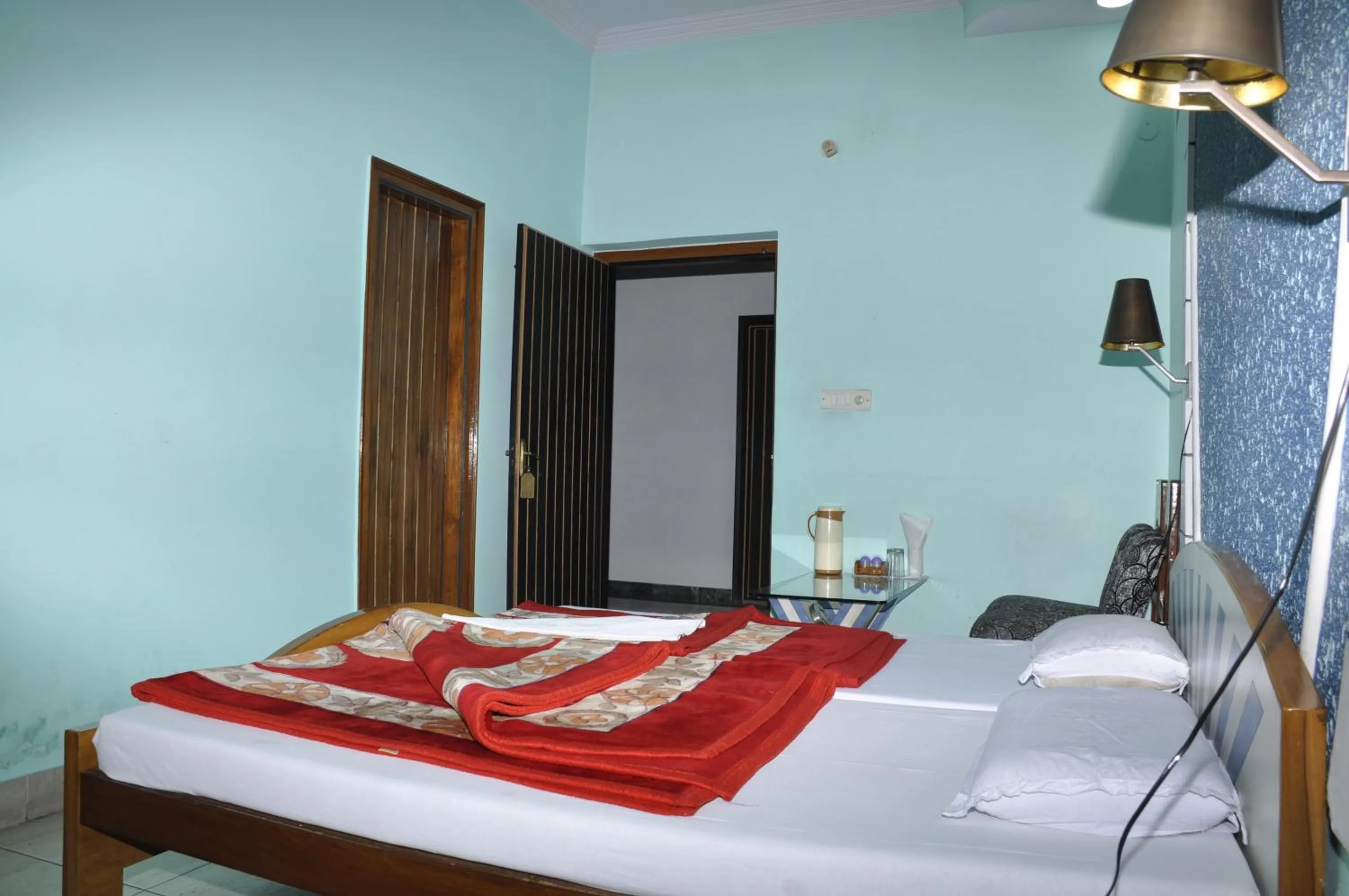 Bed in Hotel Pratiksha