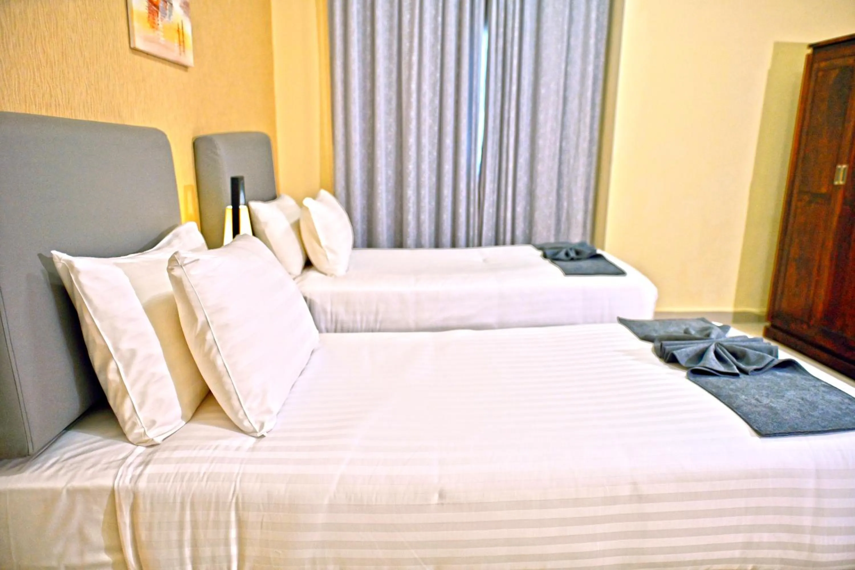 Bed in Ewan Tower Hotel Apartments