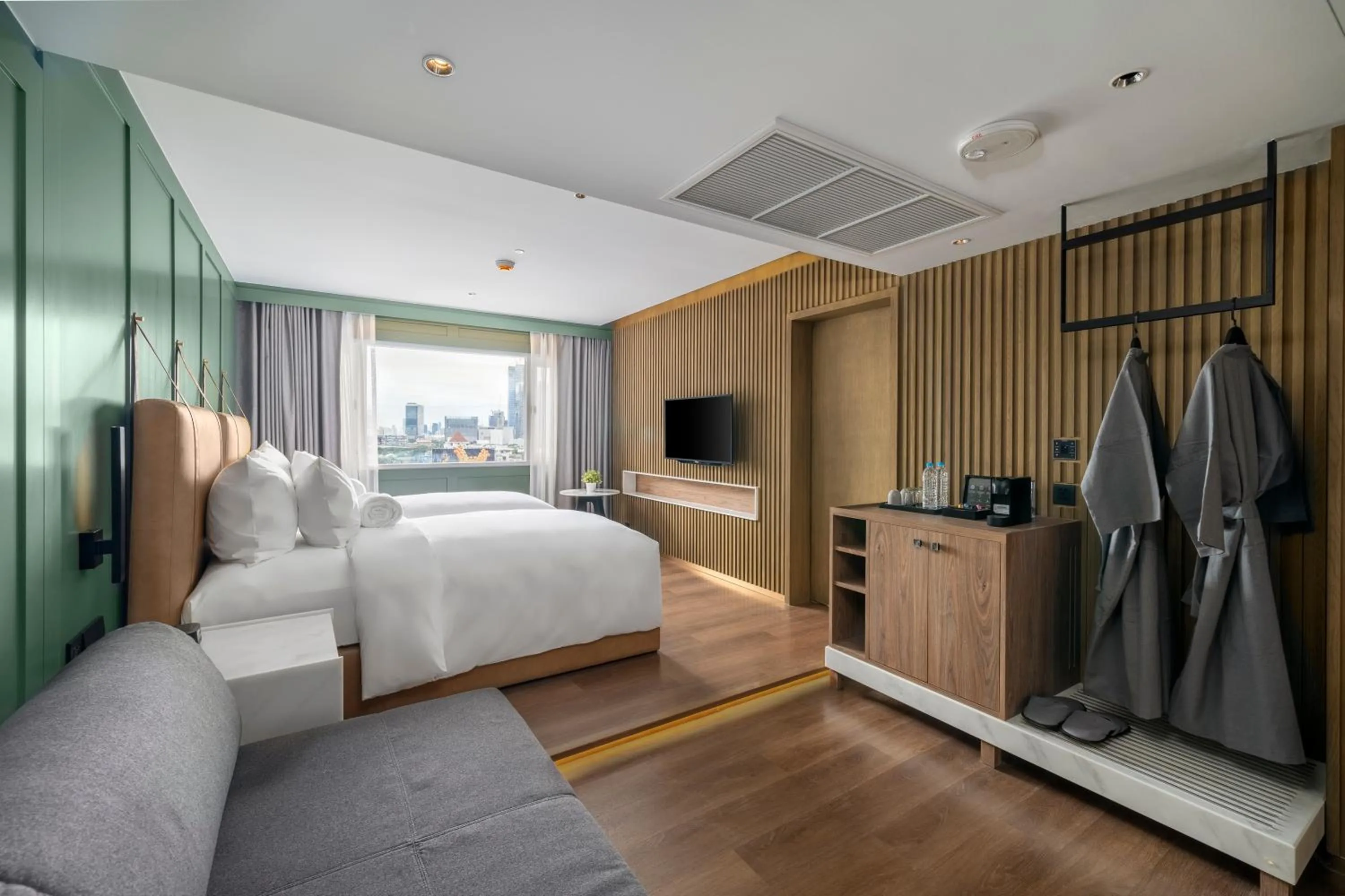 Seating area, Bed in Rajah Hotel