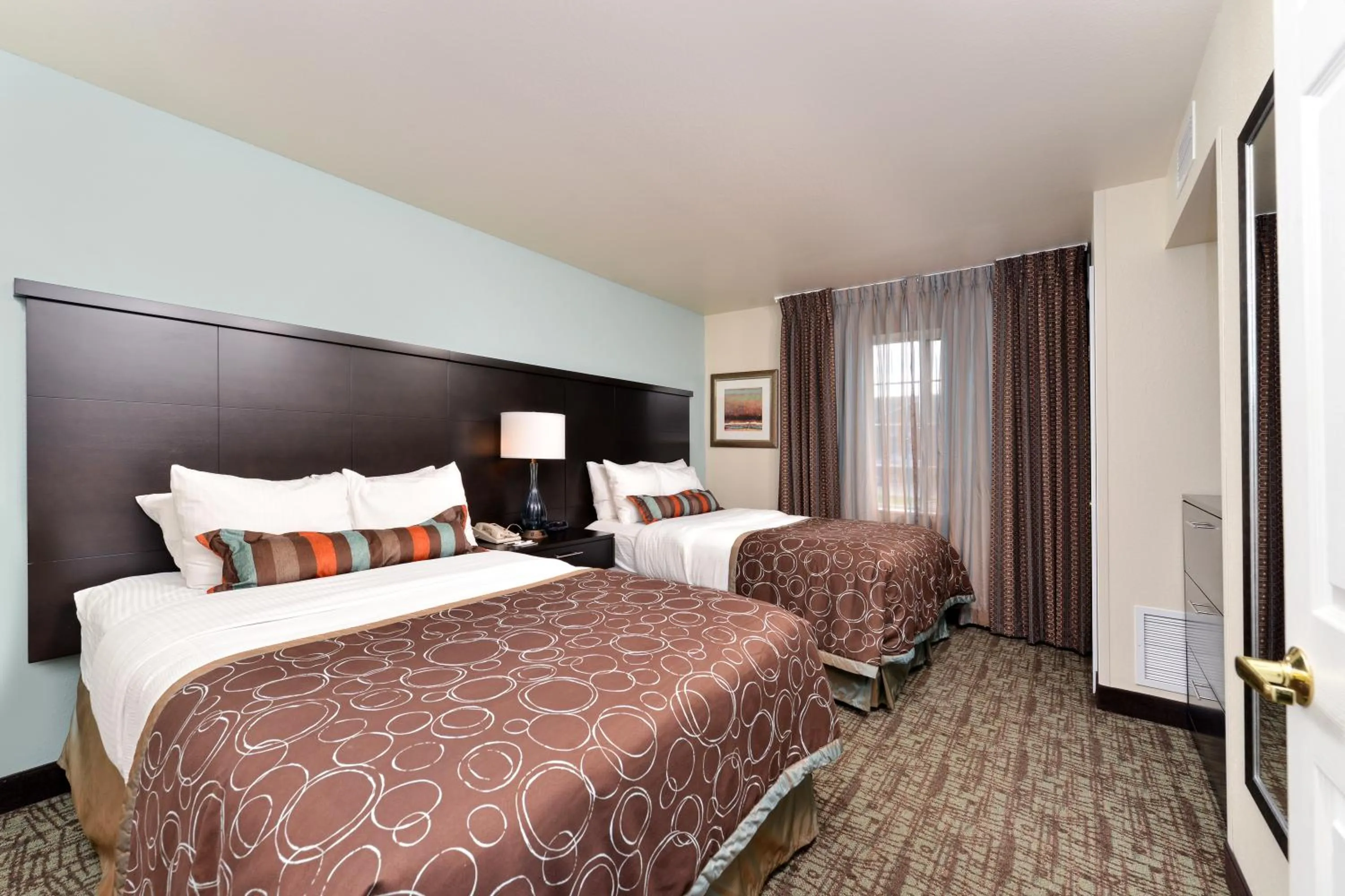 Bed in Staybridge Suites Sioux Falls at Empire Mall by IHG