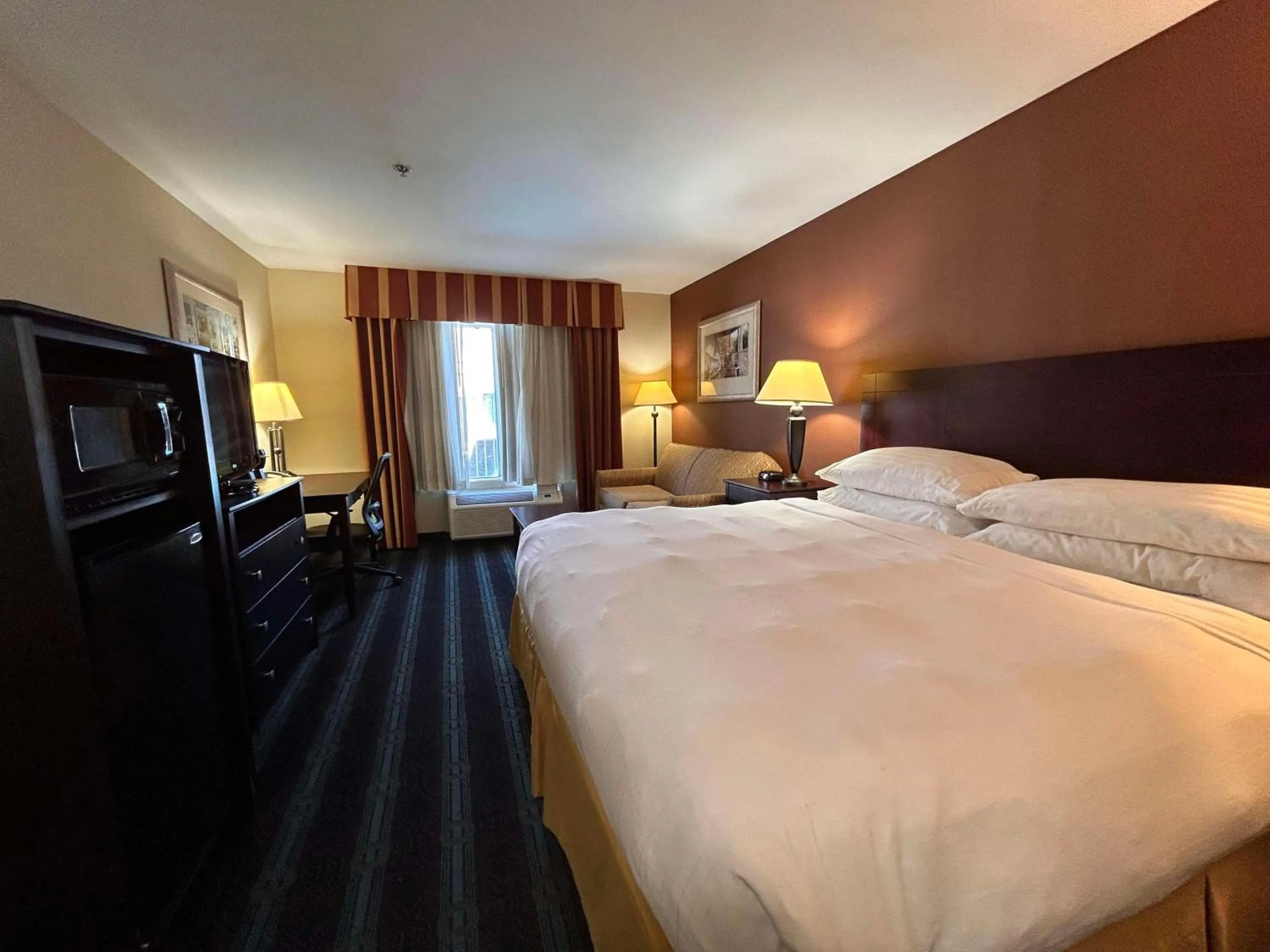 Bedroom, Bed in Express Inn Leesville Ft Johnson, SureStay Collection by Best Western