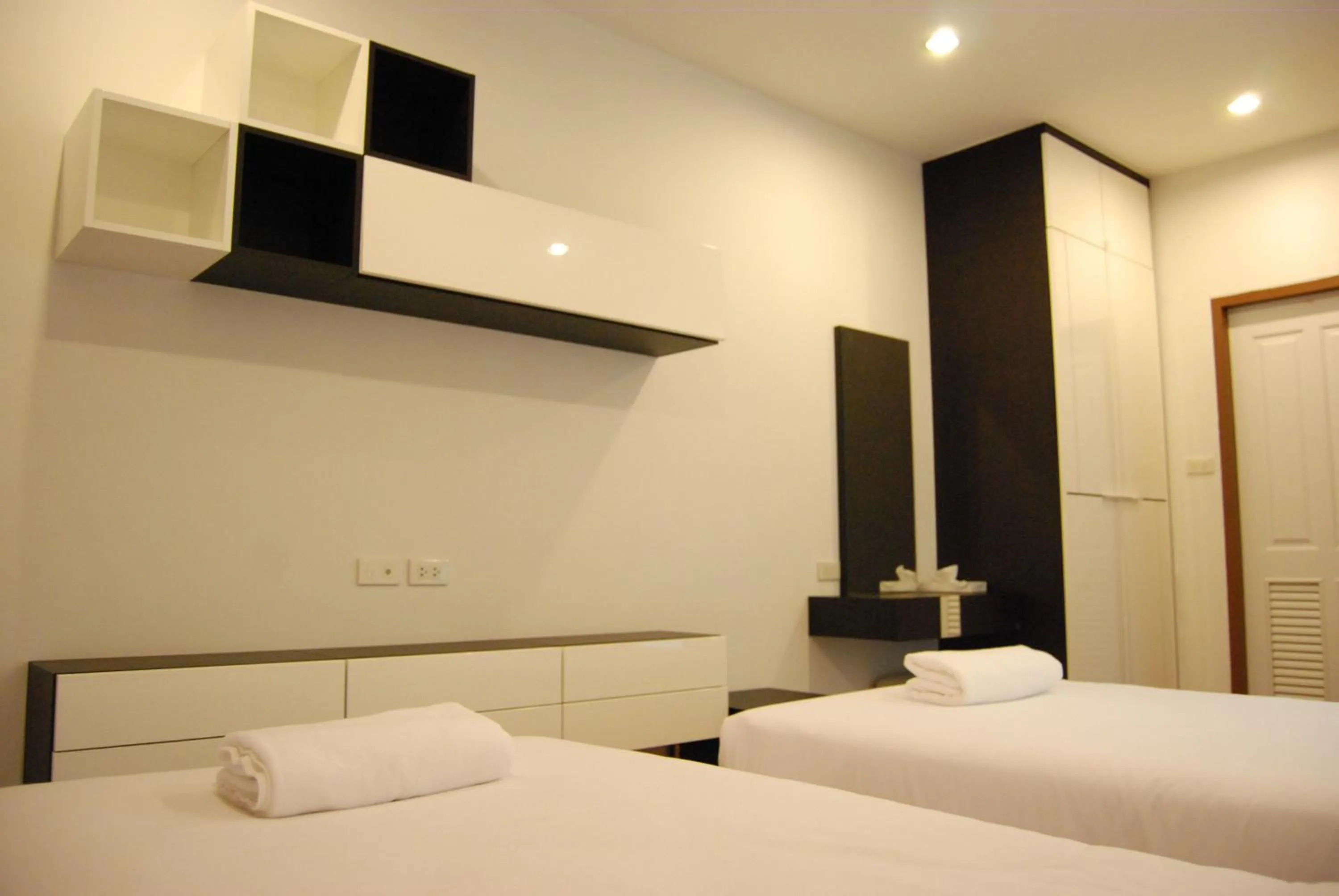 towels, Bed in V-twin Donjan Service Apartment