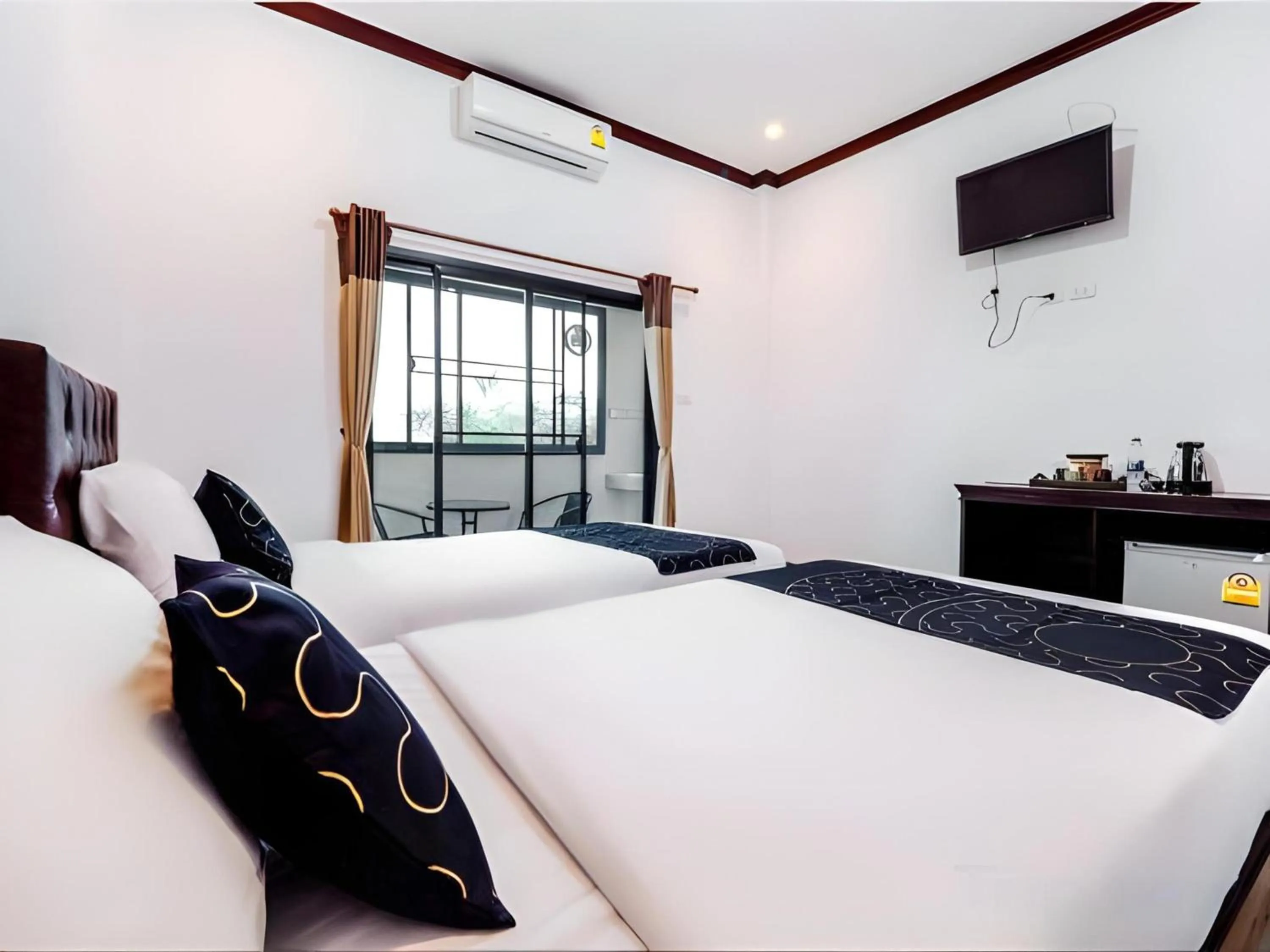 Photo of the whole room in Capital O 727 Be One Resort