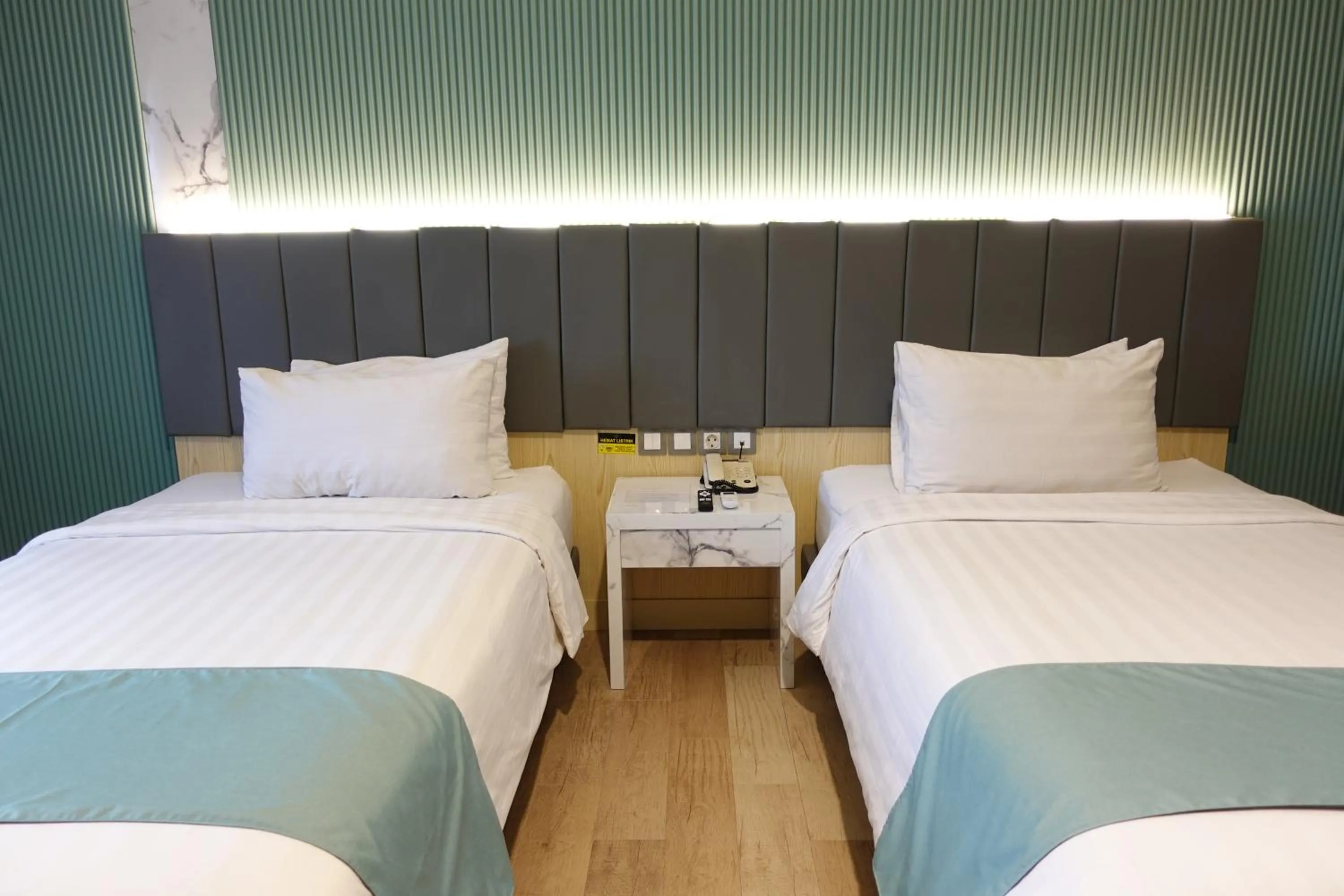 Bedroom, Bed in Grand Kangen Hotel Urip Sumoharjo