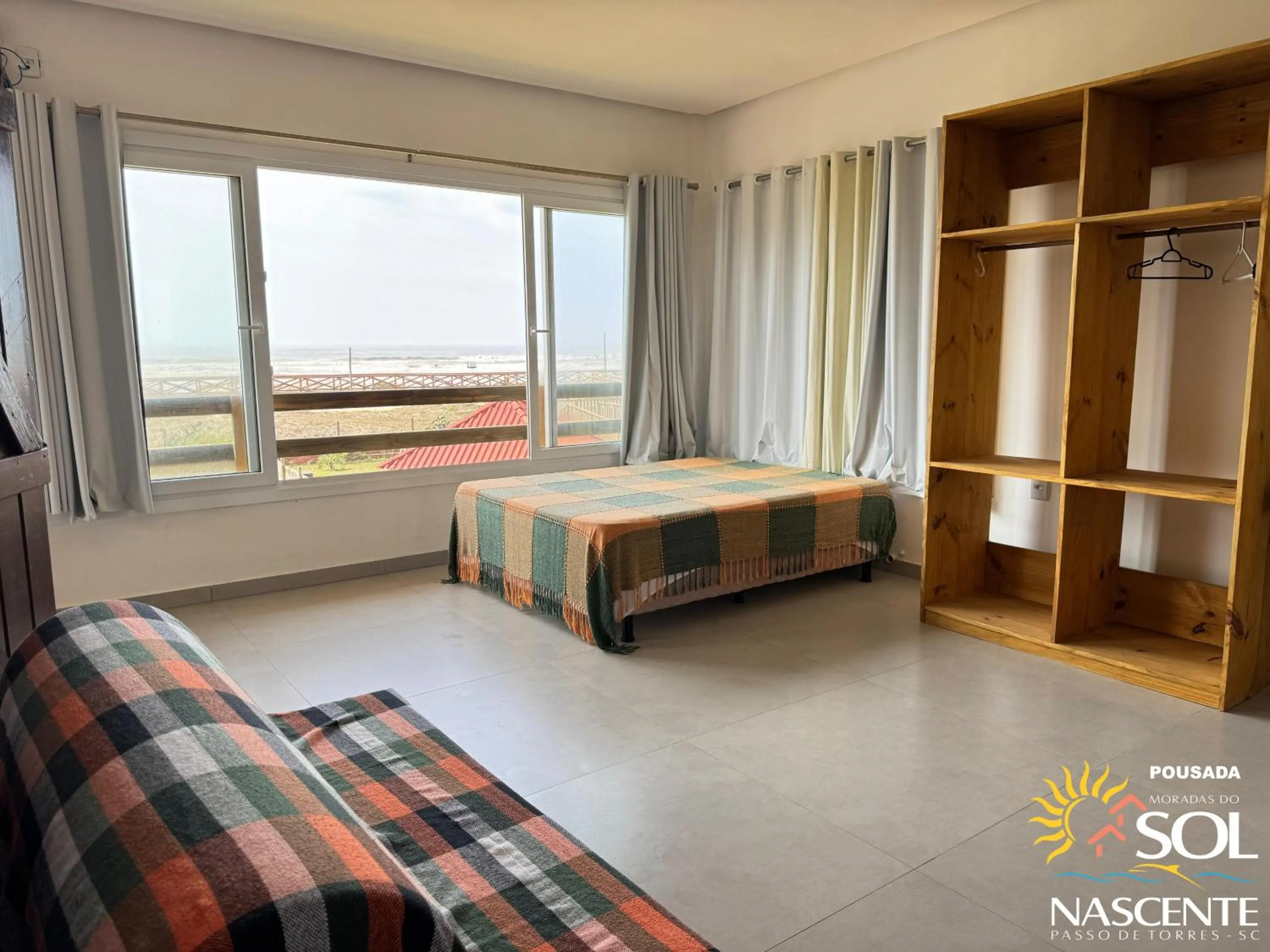 Photo of the whole room, Bed in Pousada Moradas do Sol Nascente