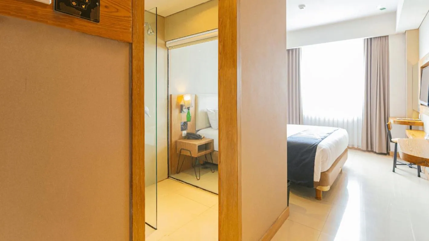 Bed in Yellow Star Ambarukmo Hotel