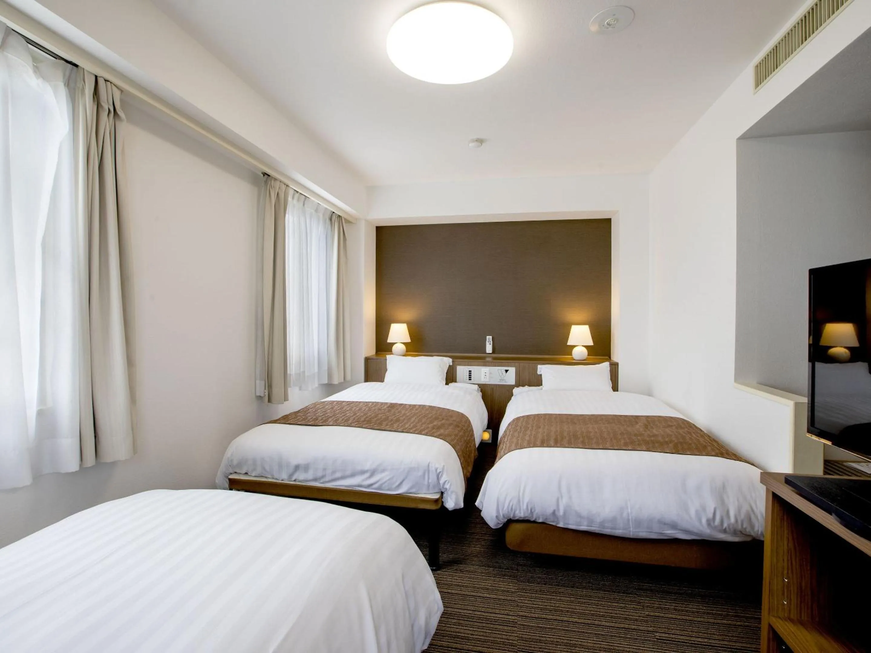 Bed in KOKO STAY Hitachi- formerly Hotel Wing International Hitachi