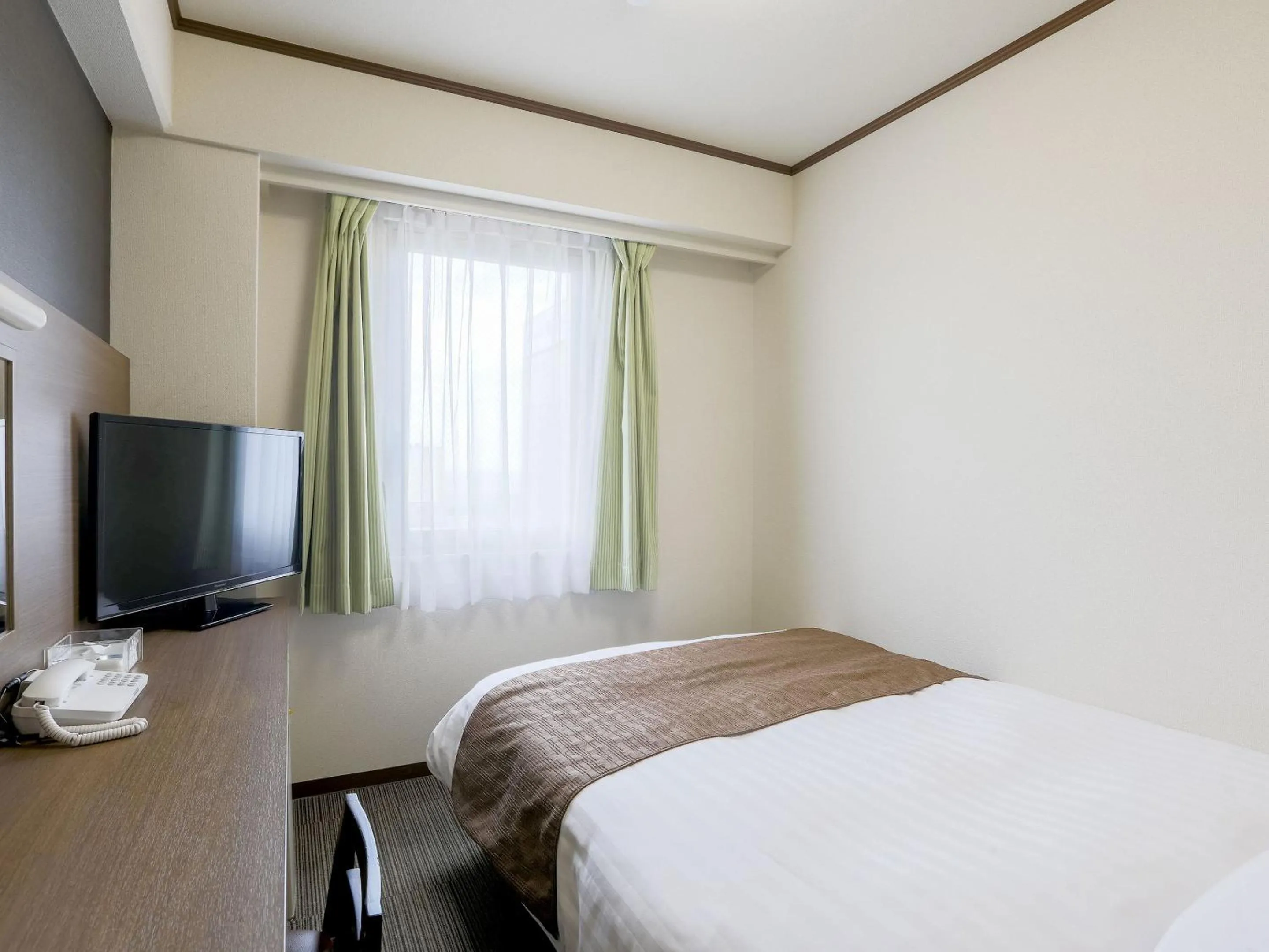 Bed in KOKO STAY Hitachi- formerly Hotel Wing International Hitachi