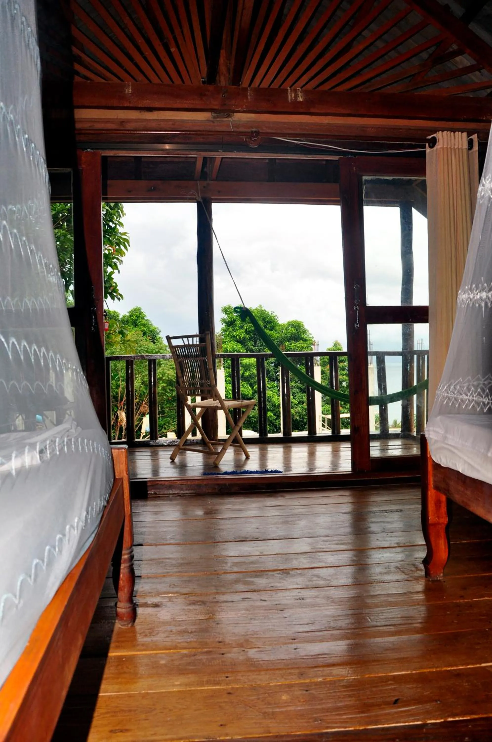 Landmark view, Bed in Happy Elephant Bungalows