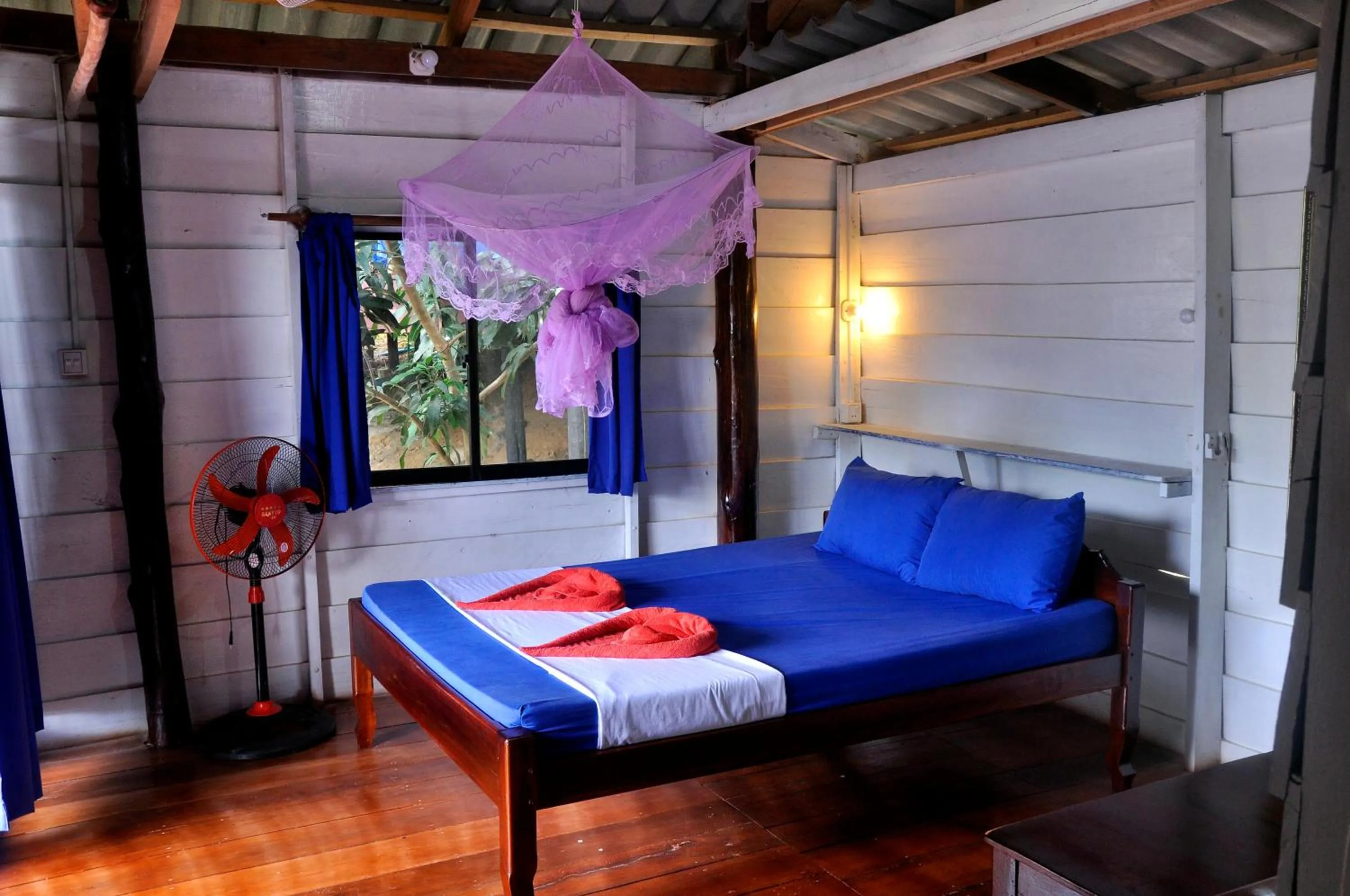 Bed in Happy Elephant Bungalows