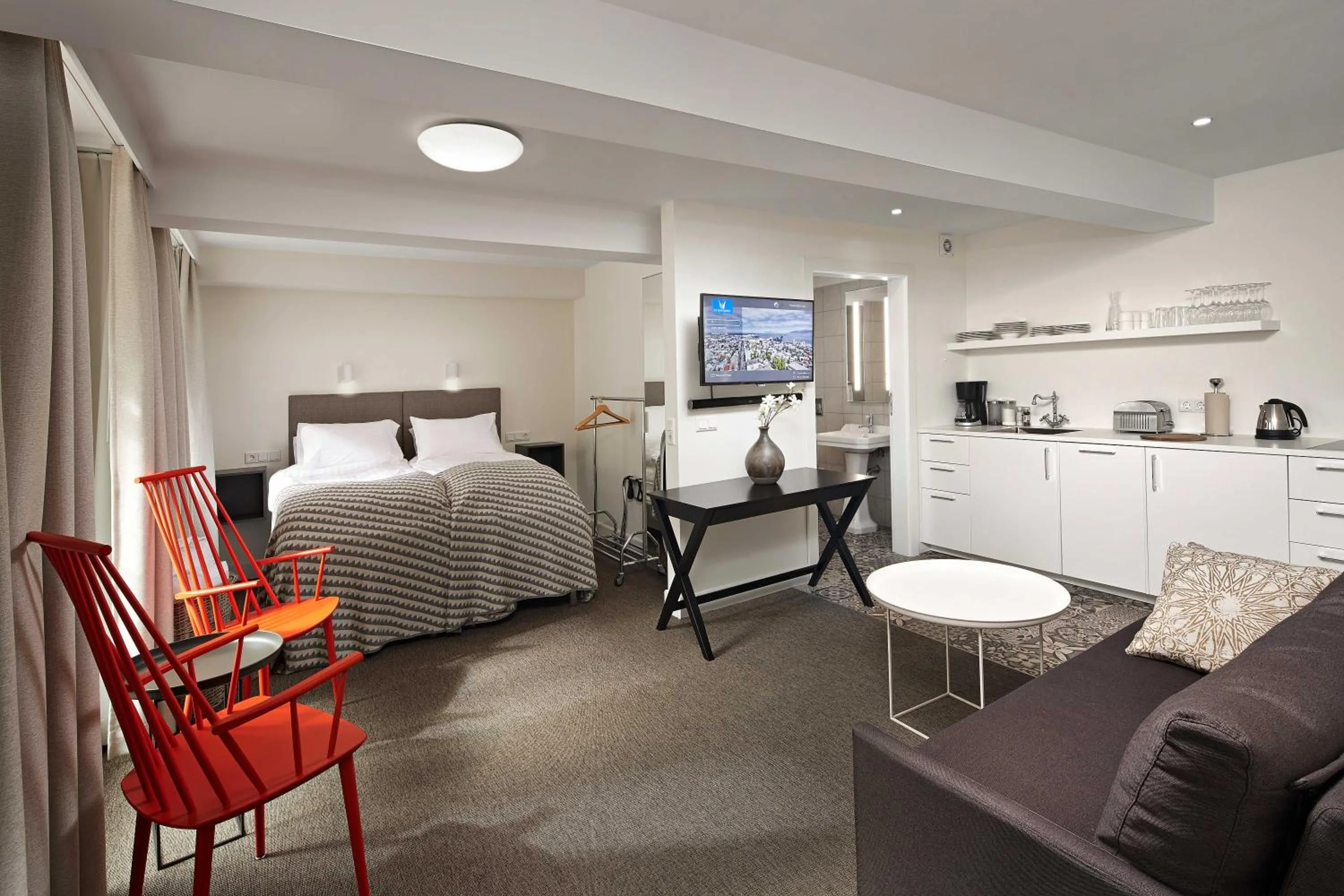 Living room, Bed in Ice Apartments Reykjavik by Heimaleiga