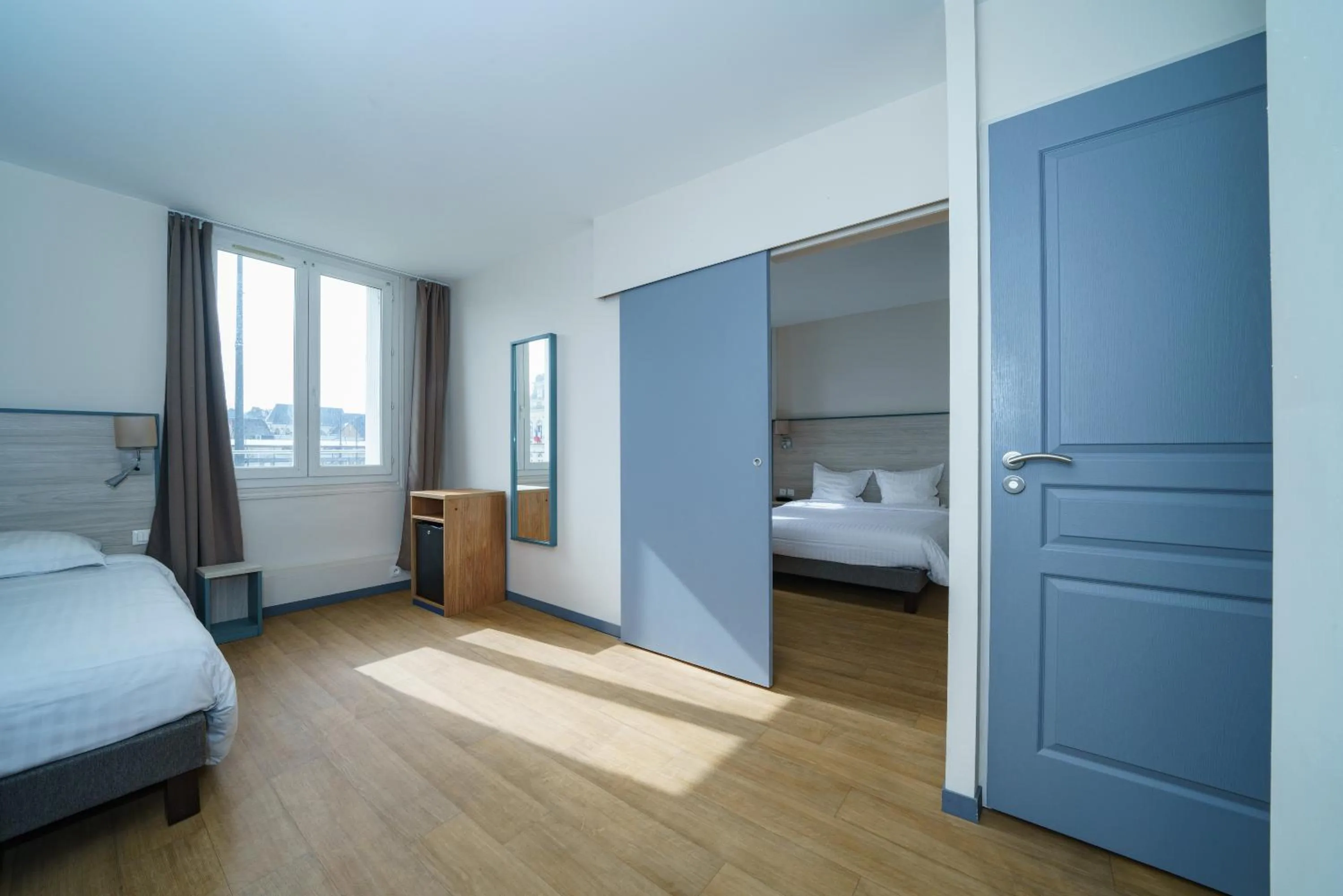 Bed in Logis Le Grand Hotel