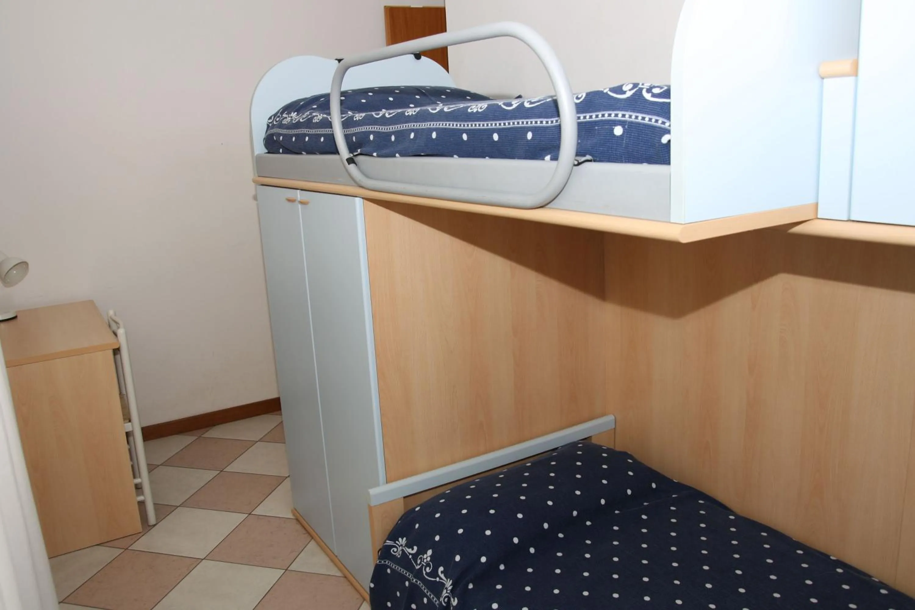 Bed in Family Apartments Residence Trieste