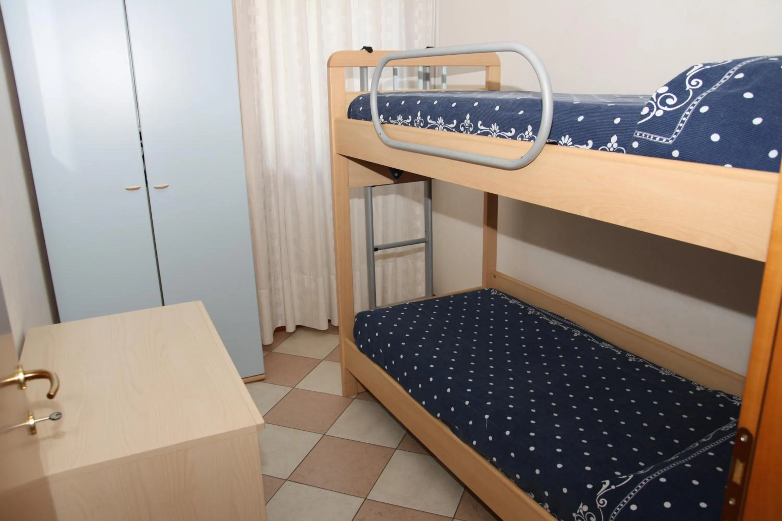 Bedroom in Family Apartments Residence Trieste