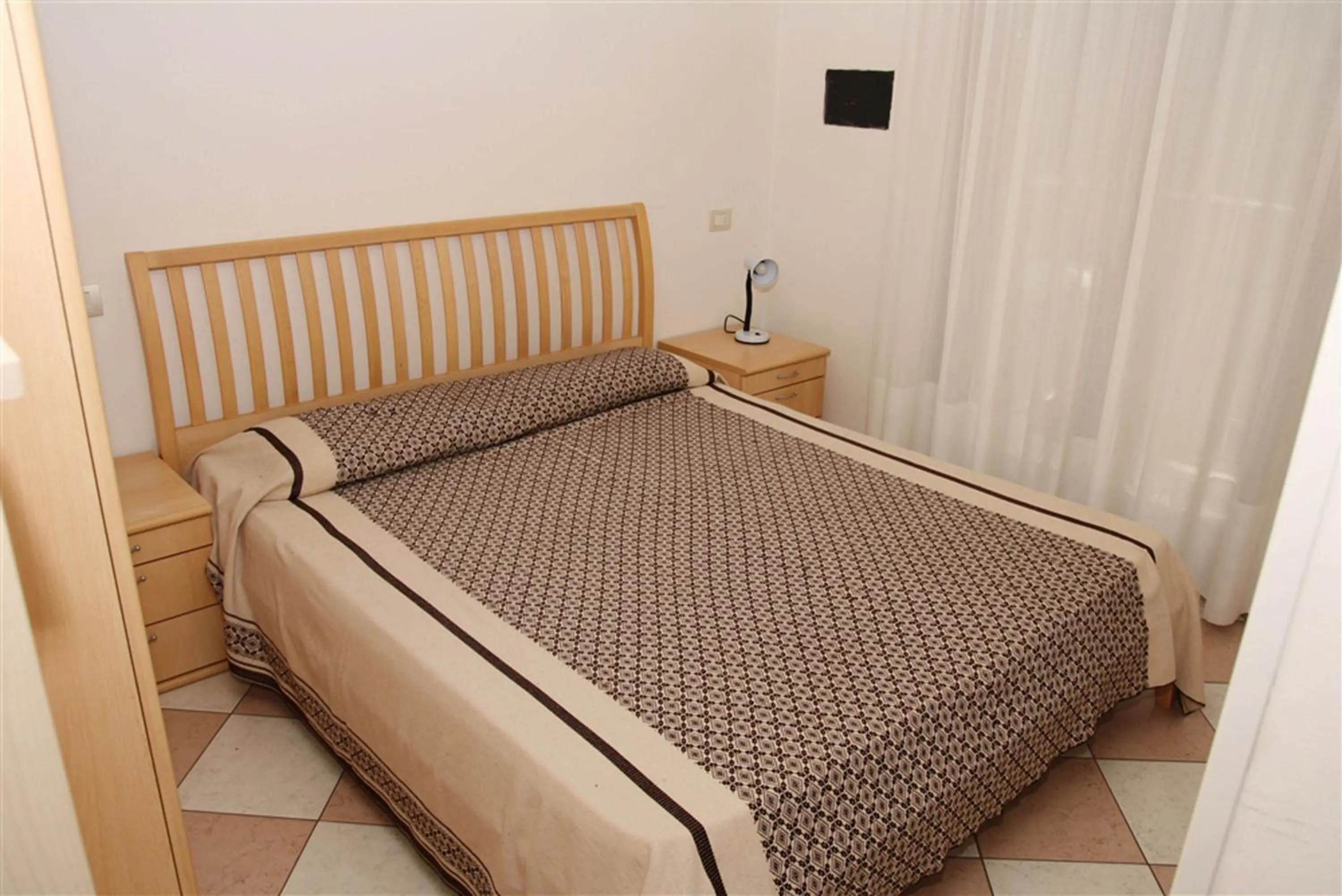 Bedroom in Family Apartments Residence Trieste