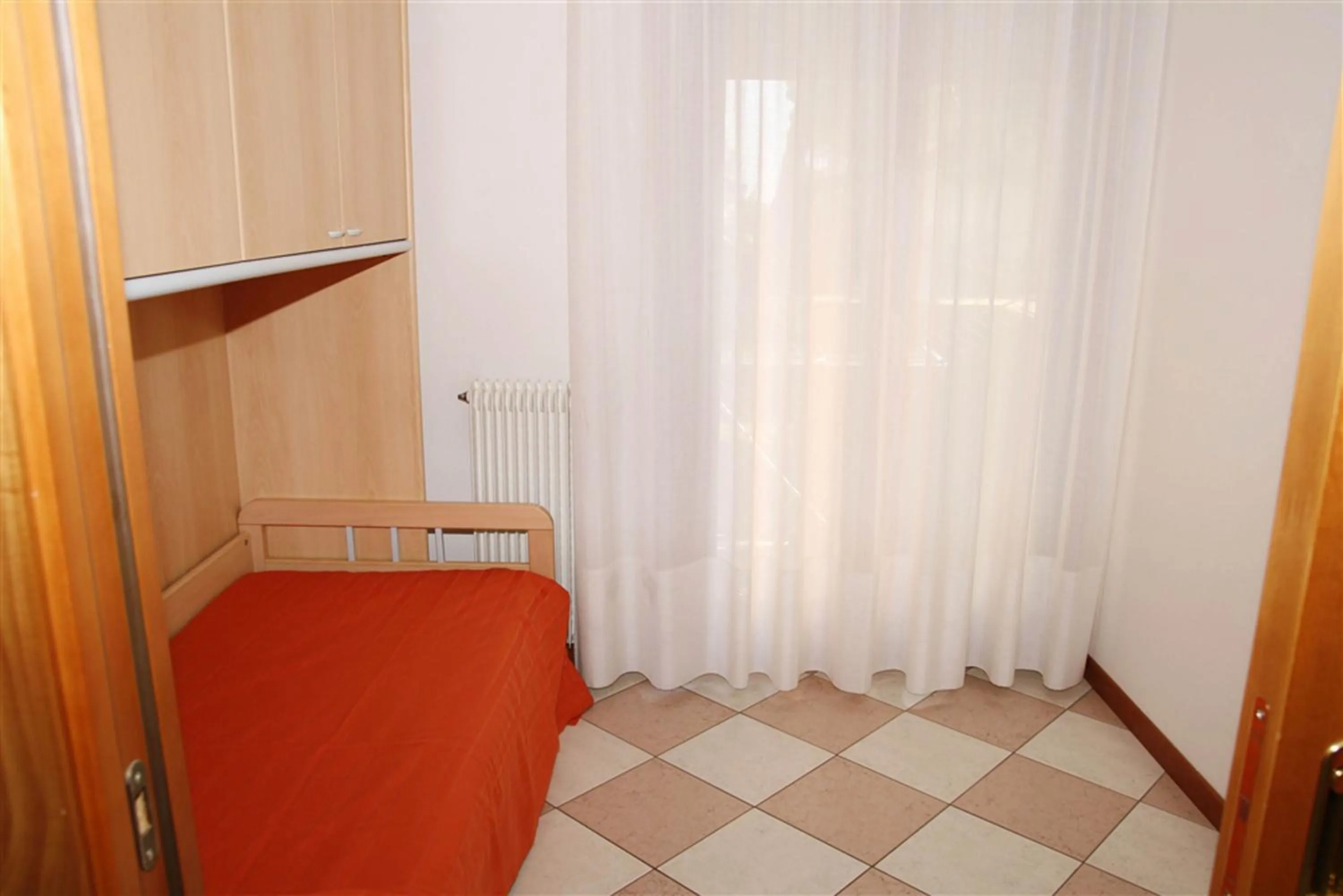 Bedroom in Family Apartments Residence Trieste