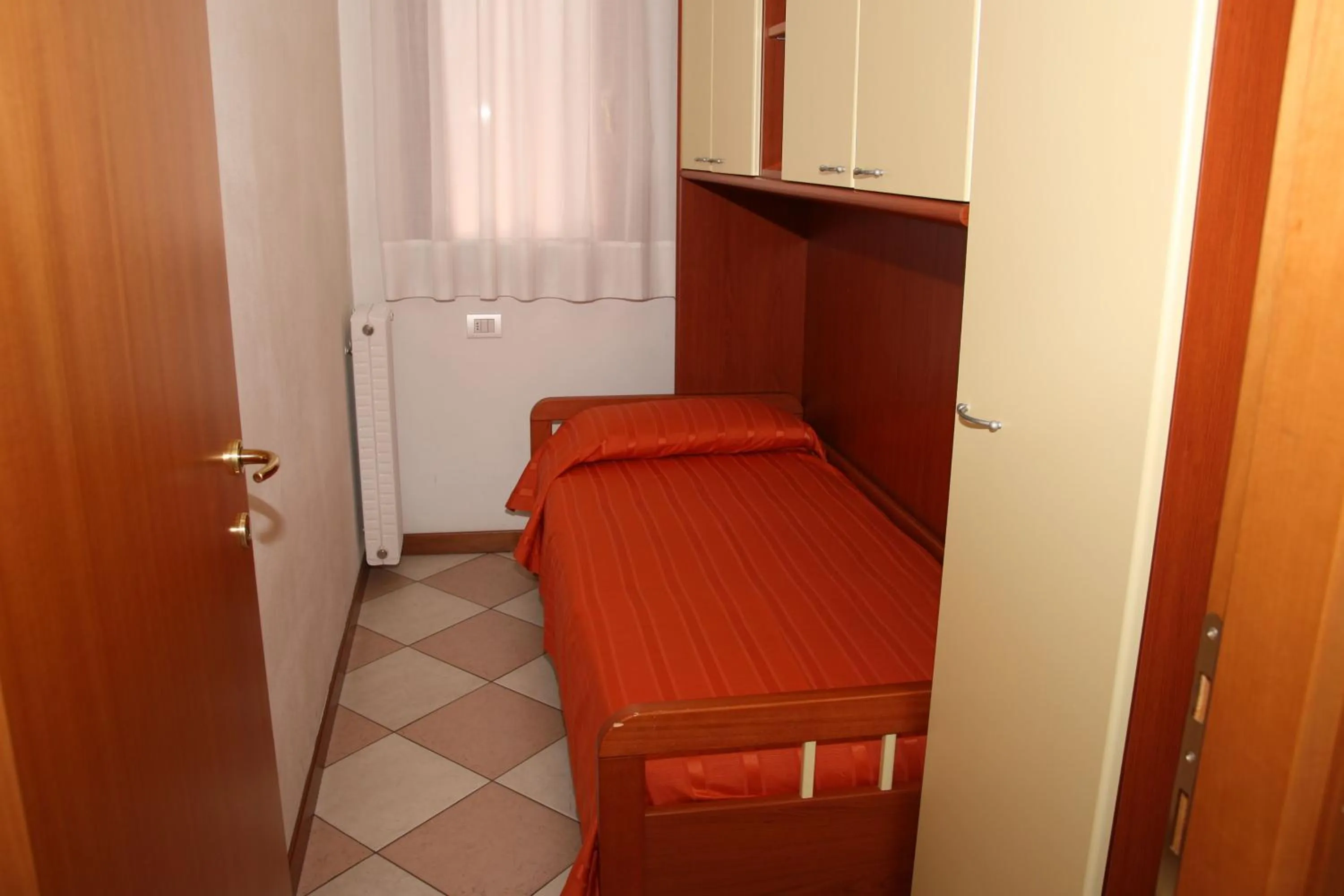 Bed in Family Apartments Residence Trieste