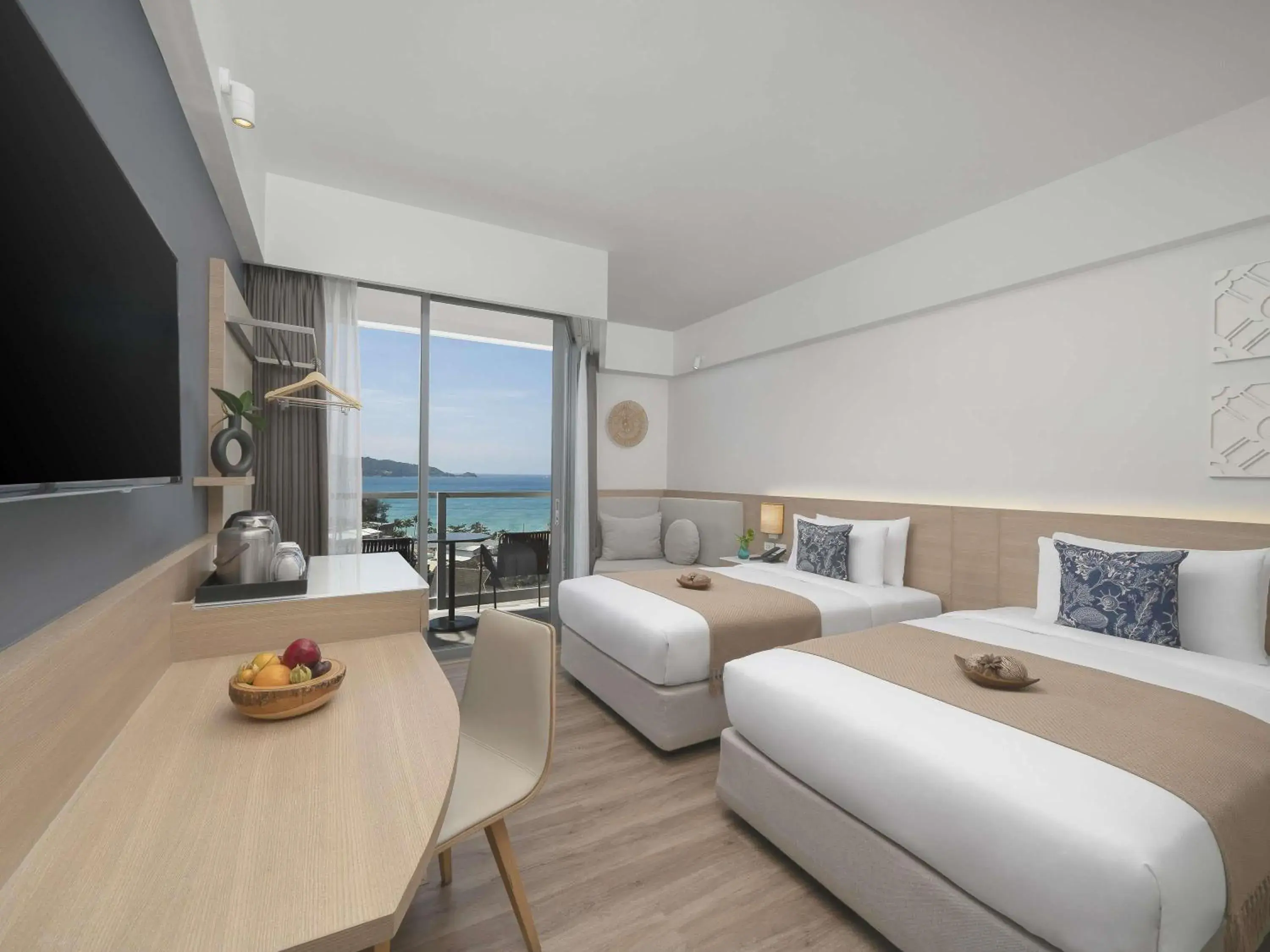 Deluxe Twin Room with Balcony and Sea View in Andaman Beach Hotel Phuket - Handwritten Collection Deluxe Twin Room with Balcony and Sea View in Andaman Beach Hotel Phuket - Handwritten Collection