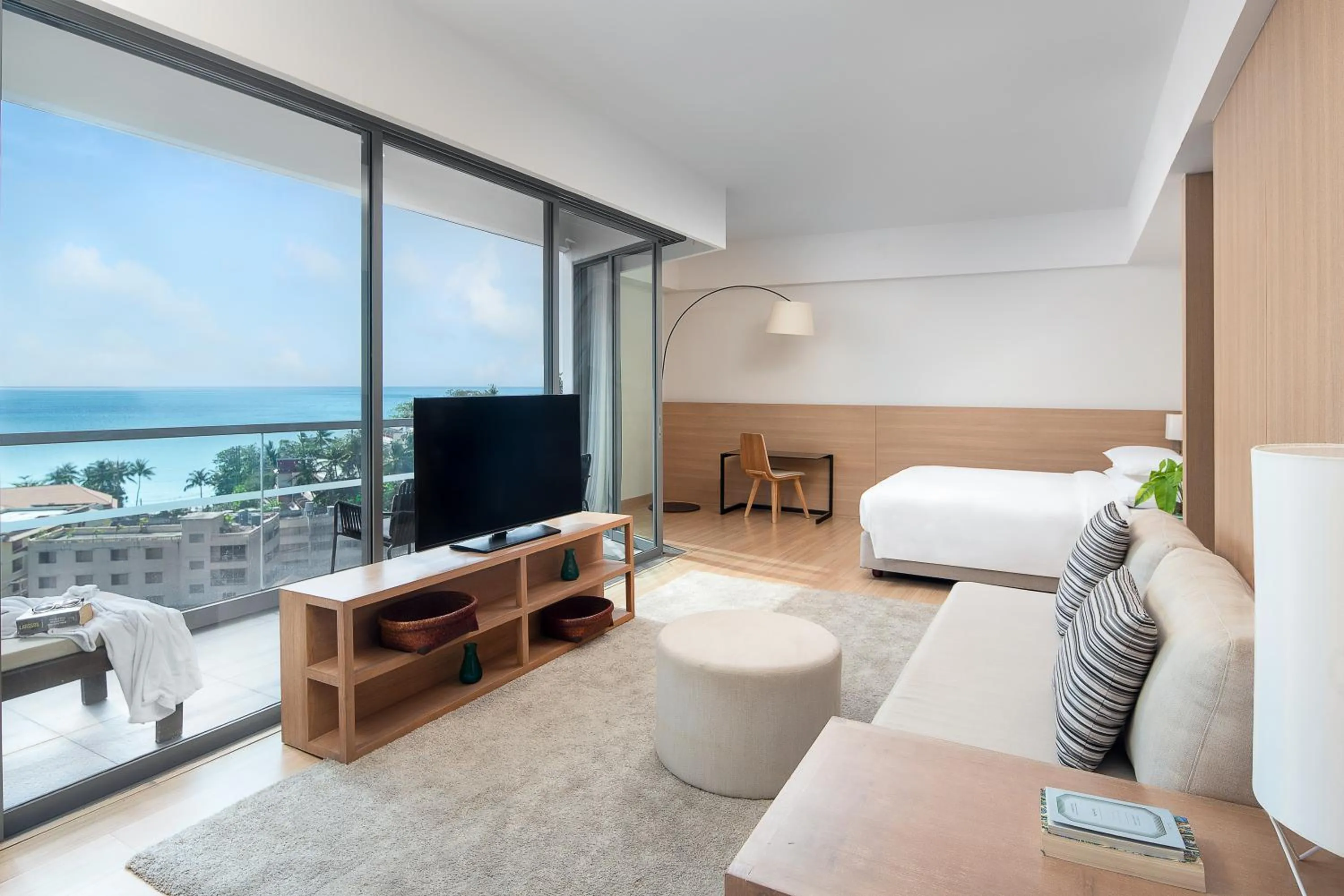 Living room, Bed in Andaman Beach Hotel Phuket - Handwritten Collection