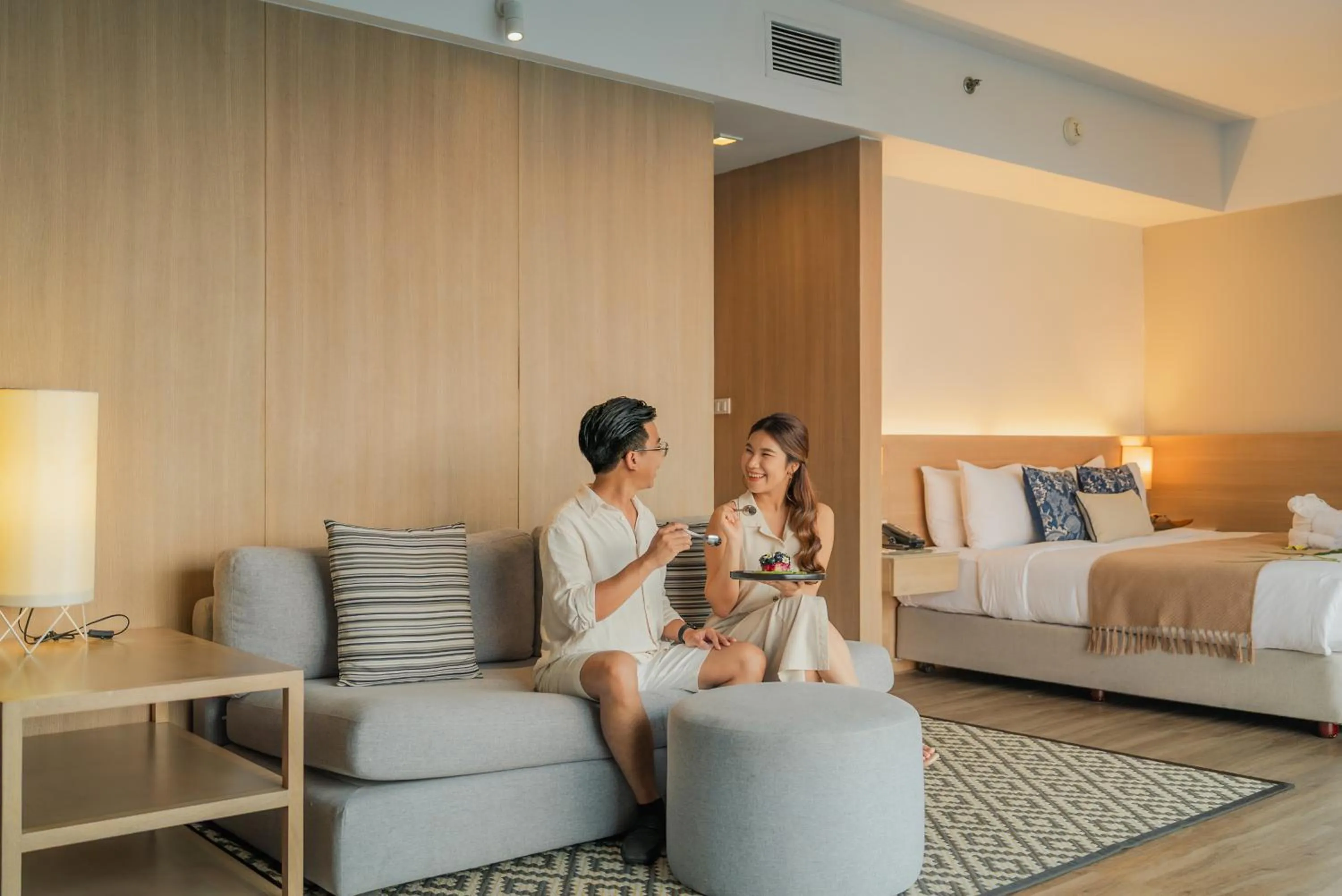 Living room, Bed in Andaman Beach Hotel Phuket - Handwritten Collection